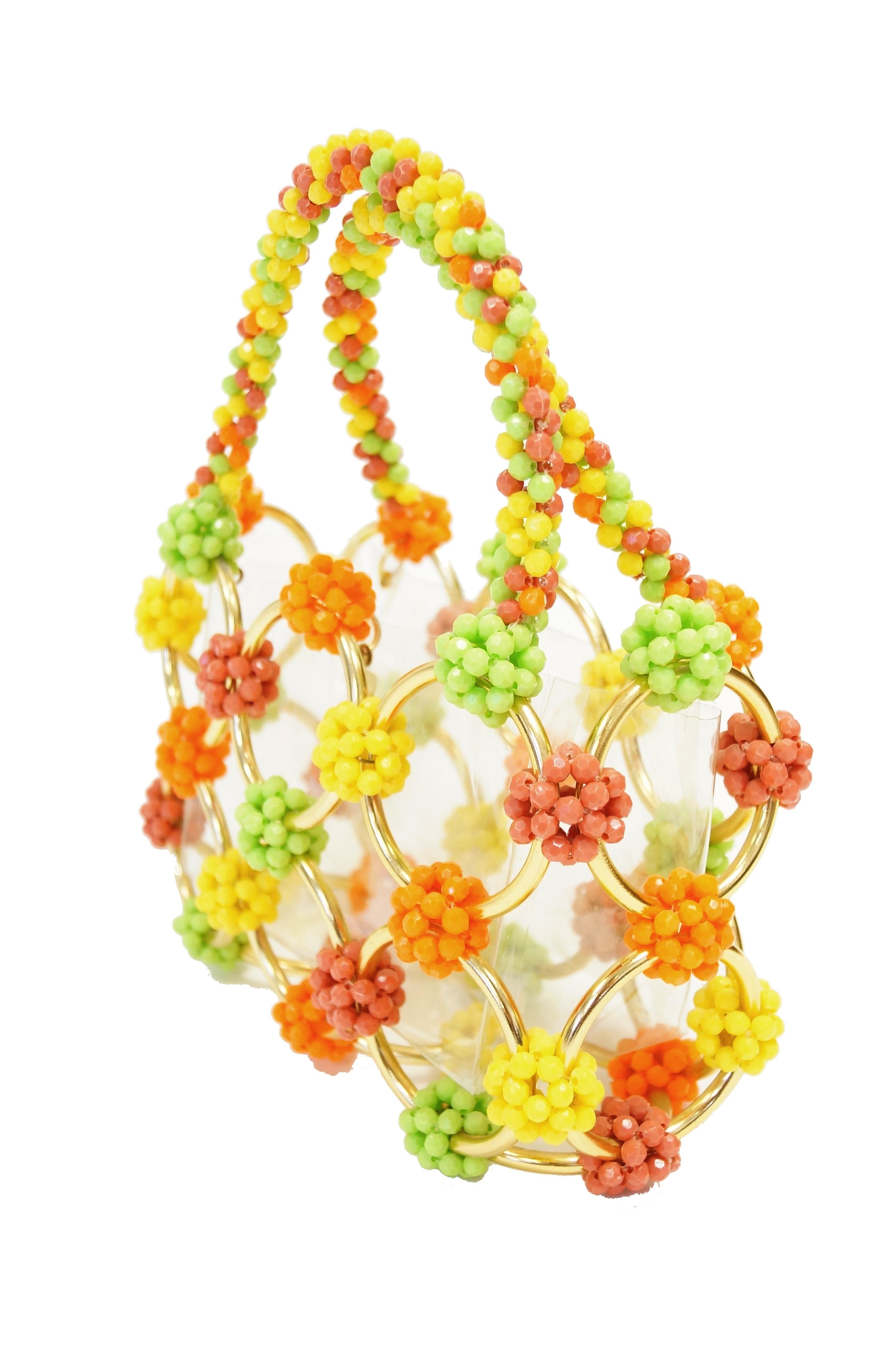 Playful and nearly impossible to find, comes this hand Italian made beaded handwork bag! This fabulous bag is composed of bright candy- like clusters of multifaceted beads and round gold - tone hoops.  The handbag has a top handle made entirely of