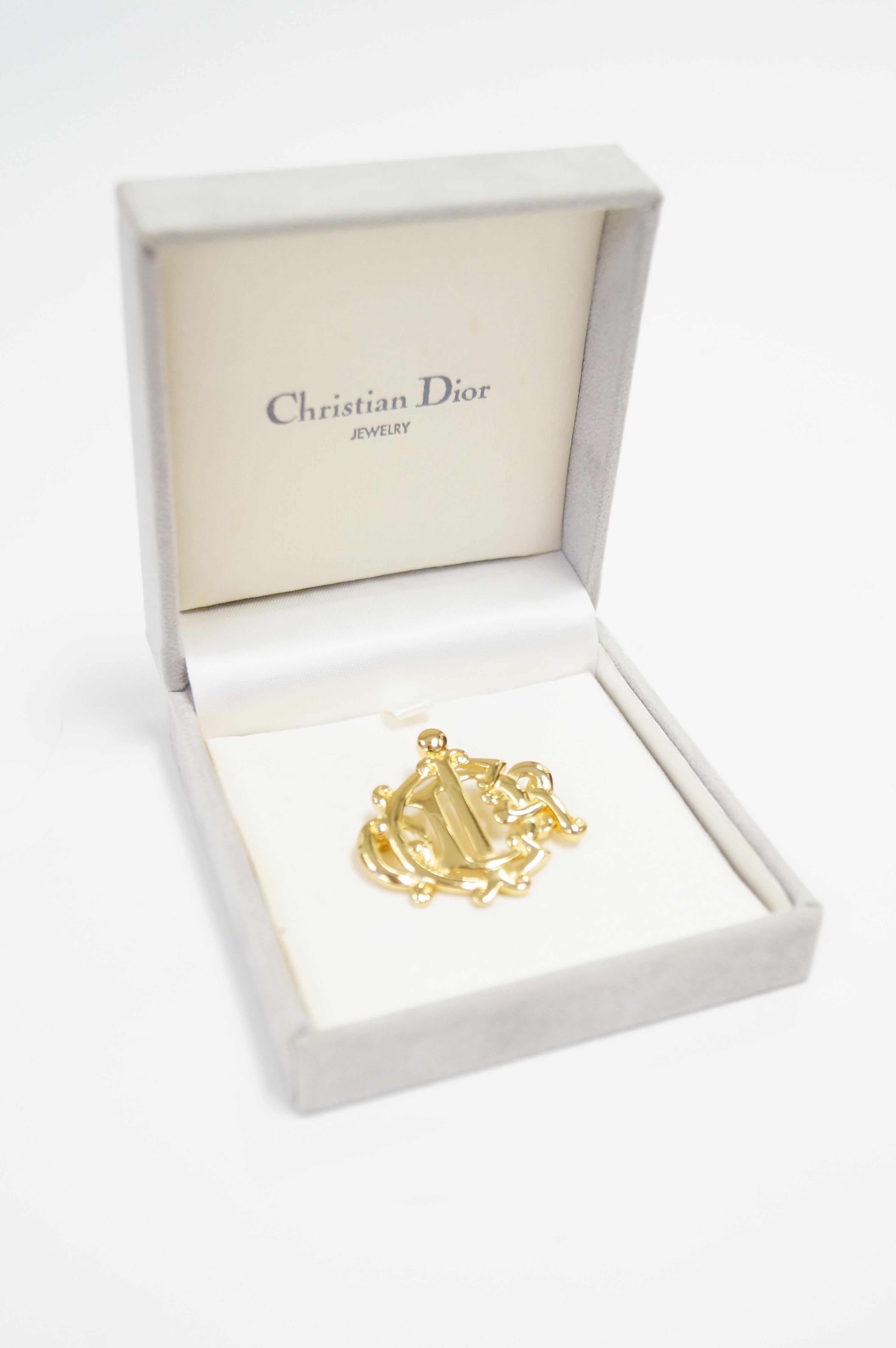 Amazing vintage Christian Dior initial brooch. The vermeil brooch features the elegantly intertwined 