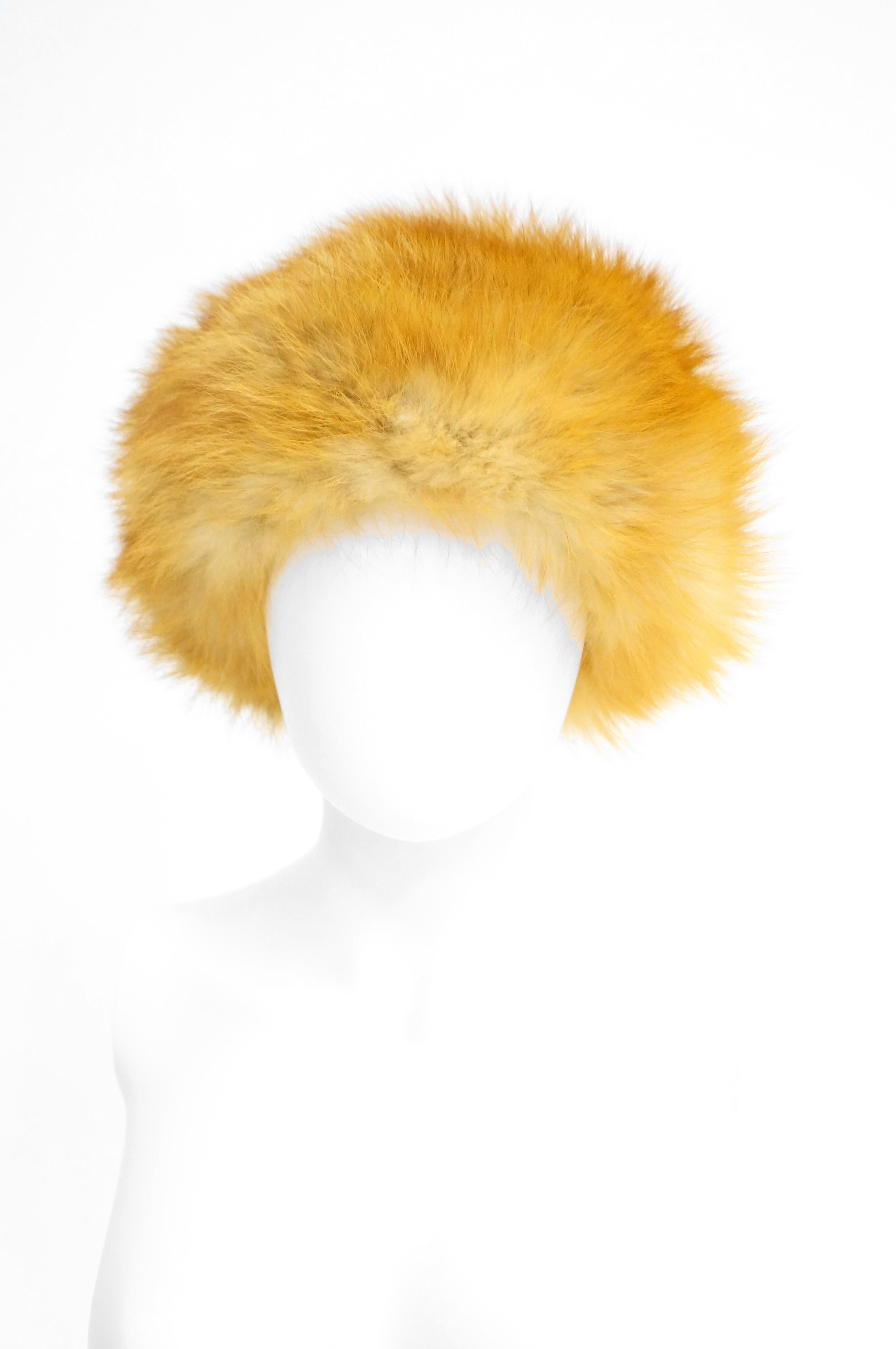 Amazing, luxurious golden fox fur cap! This hat is wonderfully plush, with long brushed fox fur that spreads out evenly throughout. Cap is lined in black satin. 