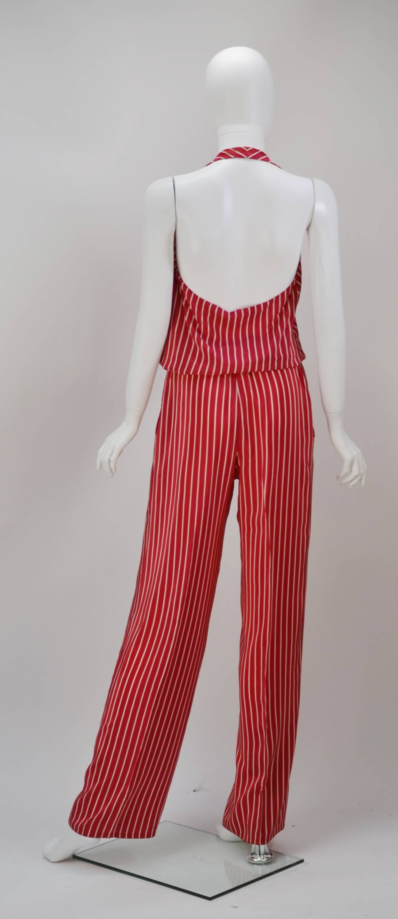 This fun and nautical look halter pantsuit was created by Coty award winner, Herbert Kaspar in the latter half of the 1970's.  Kasper studied at Parsons and moved to Paris where he worked with the Jacques Fath, Christian Dior, and Marcel Rochas.  He
