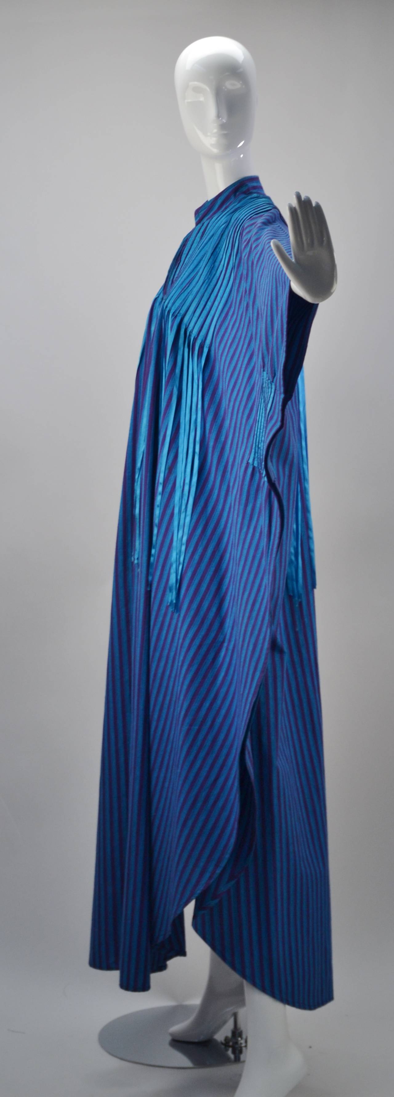Unbelievable Josefa caftan!  Vibrant cotton canvas in blue and purple with blue ribbon details is both pure comfort and makes a statement -- a great statement!!!  V-neck with mandarin collar. The gorgeous blue ribbons create beautiful movement when