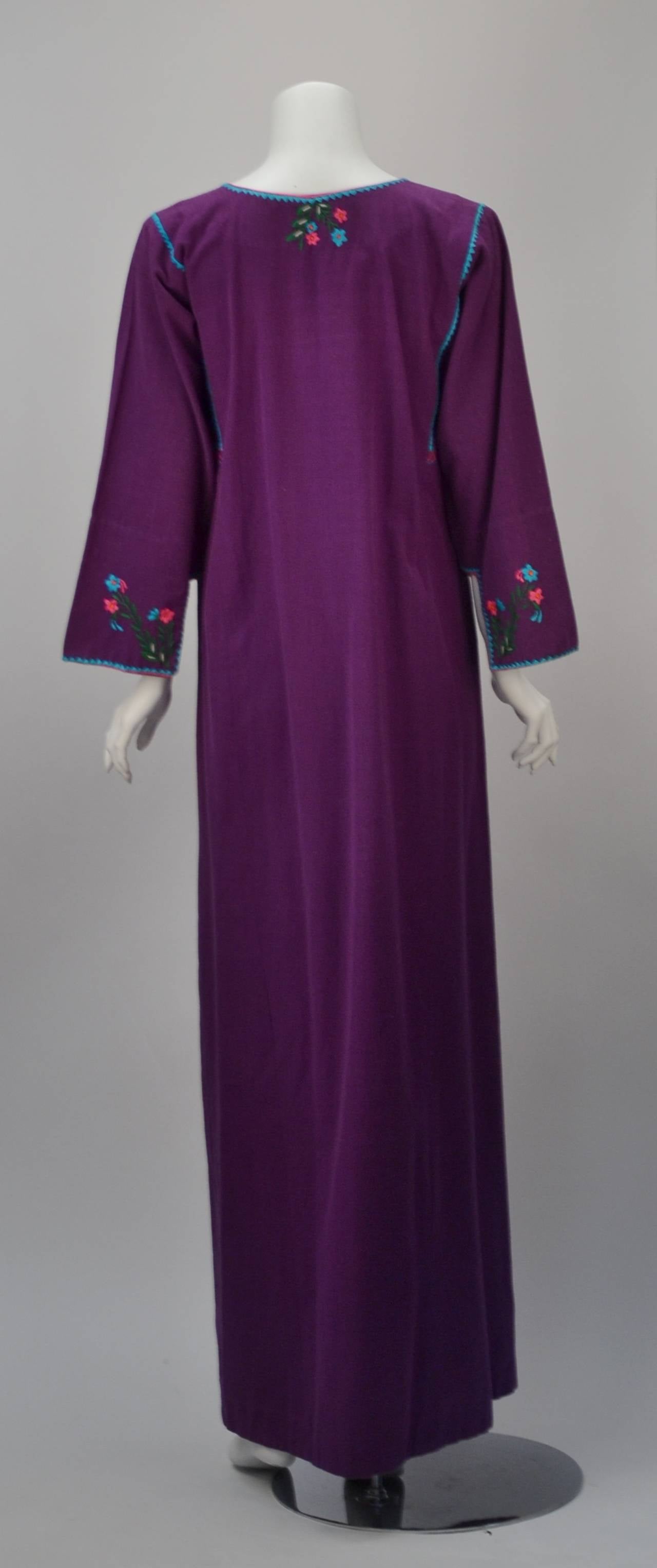 Beautiful 1970s long purple kaftan. Designer cut out sleeves and trimmings. Small floral embroidery around scooped V neckline and sleeves. 100% cotton.

One size fits all

*All garments and accessories have been professionally cleaned and thoroughly