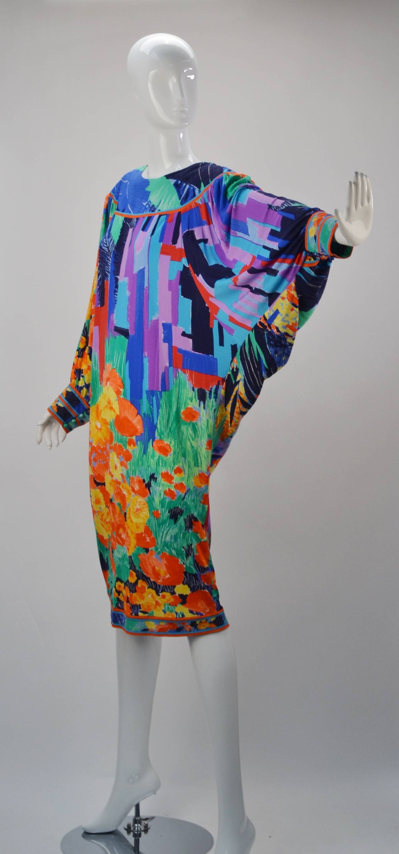 This wildly printed and colored silk Jersey Mikado batwing dress evokes vivid fun when you wear it!  The tropical print screams 