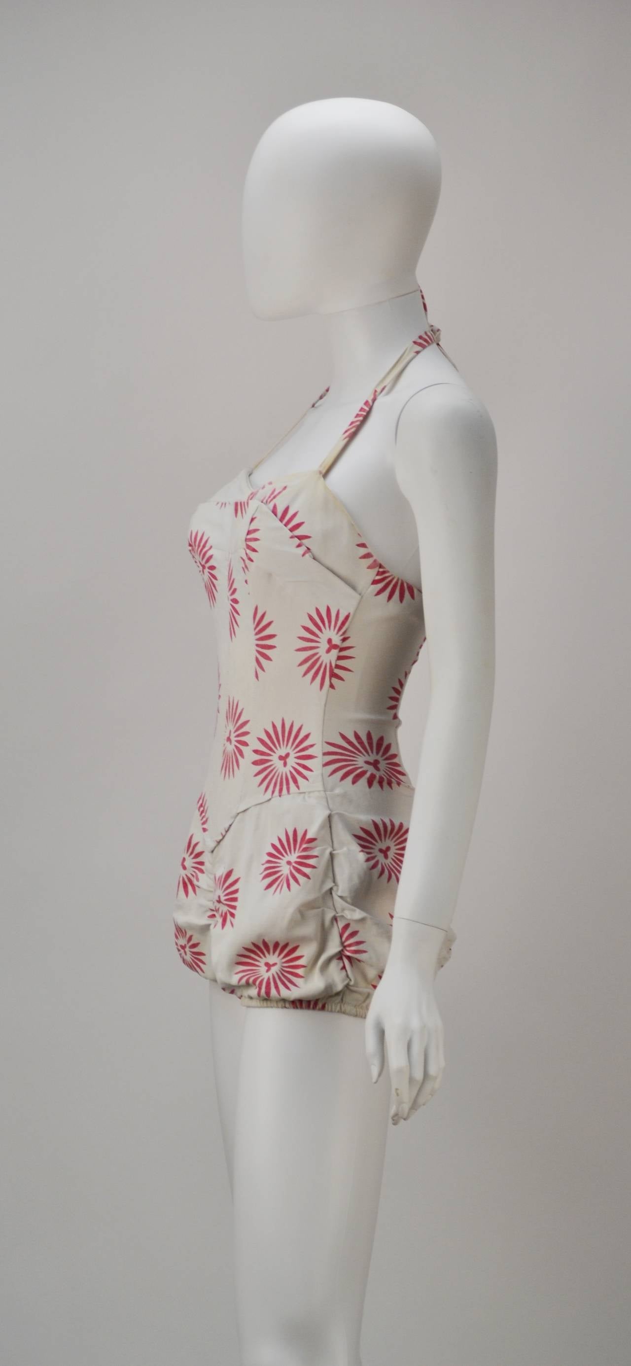 Looking for a vintage swimsuit for your winter vacation or for your short film? Swimsuits by Ms. Reid's are considered the most enviable pieces to wear and collect because of her groundbreaking prints and designs. This winner has a cute bloomer