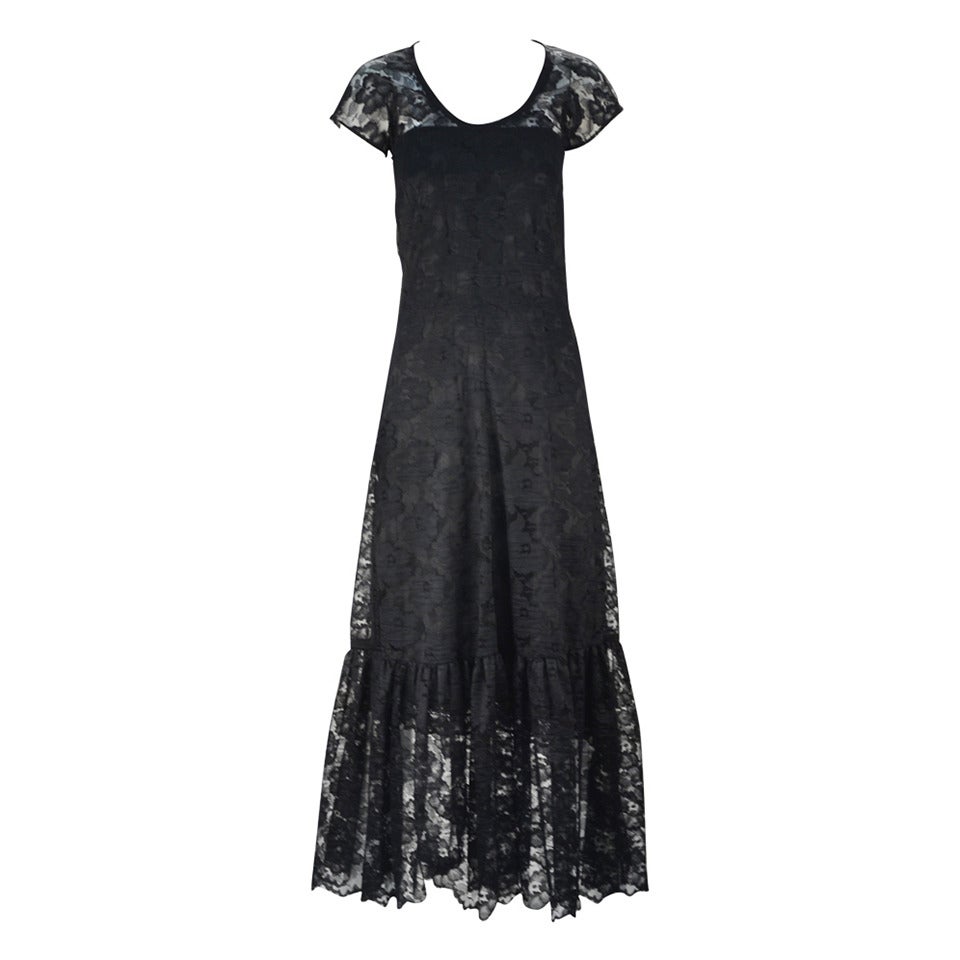 We absolutely love this vintage Biba black lace dress!  Fitted with scoop neck and short sleeves, this beautiful 70's dress evokes the 20's with its lace and drop waist.  Wear with slip (as shown) or with a catsuit for chic and modern look.  We've