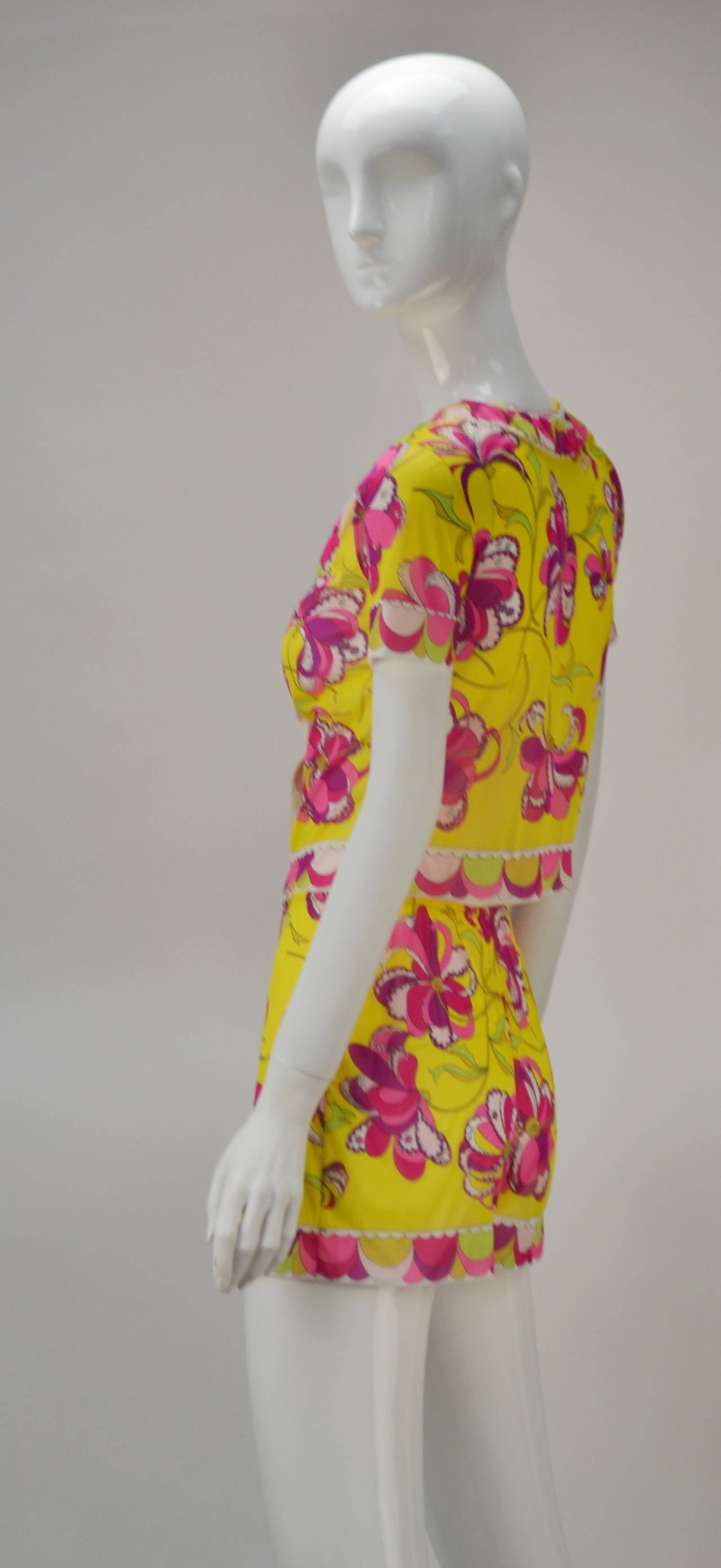 Dead stock and unworn, this bold floral print and multi-color 1960s Pucci piece is awesome as it is both wearable and considered a highly sought after collectors piece.   Designed as loungewear for its Collaboration with Formfit Rodgers, the short