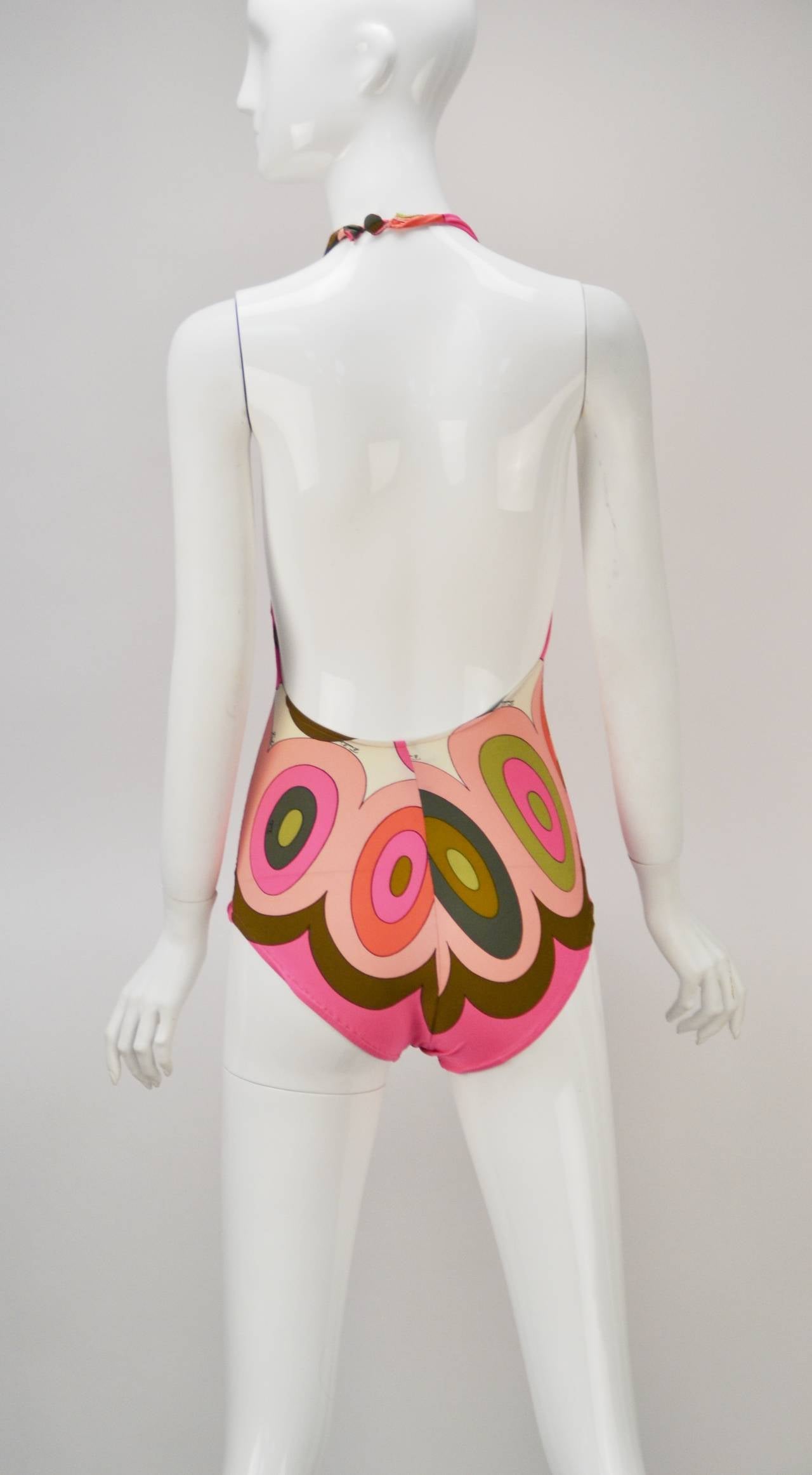 Absolutely unbelievable Pucci Swimsuit and Swimshirt is perfect for summer fun.  The piece hails from the estate of a former employee, is unworn, and was preserved brilliantly.  It looks brand new!  

This classic will go fast!  

...Enough Said.