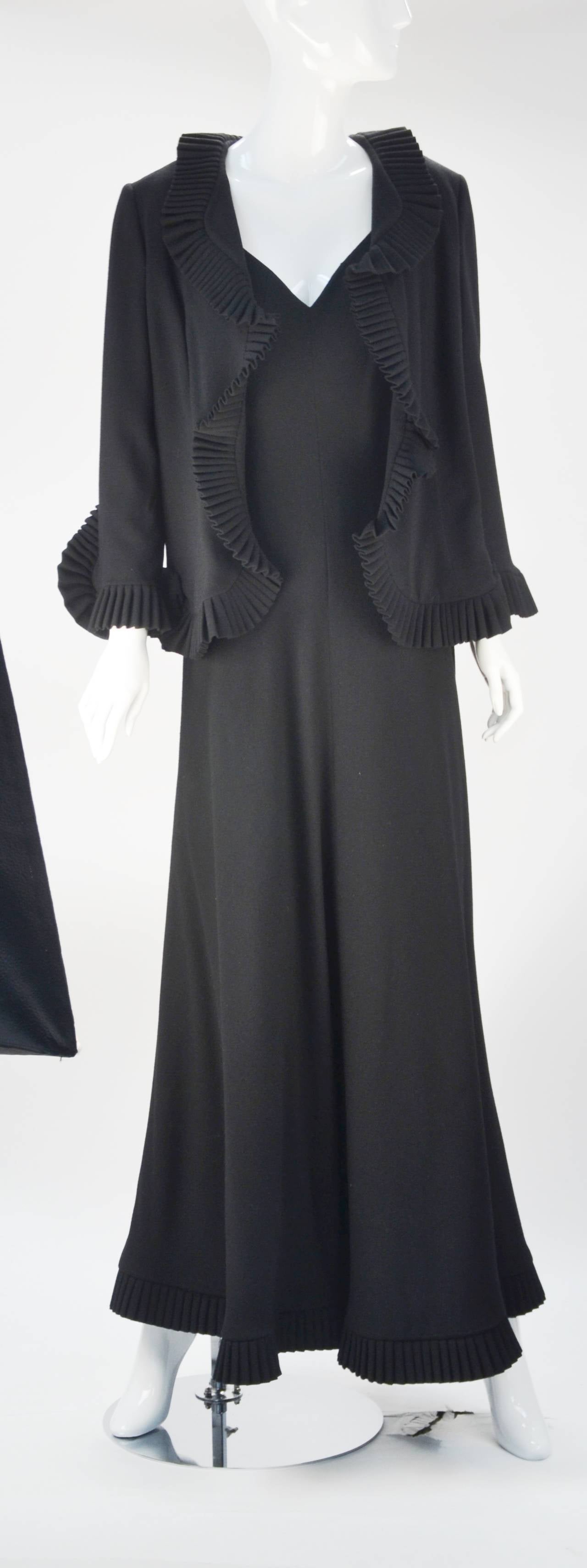 Marilyn Lewis knew how to design for the body.  Worthy of both museum display and red carpet wear, this black ensemble exemplifies her aesthetic with its perfect silhouette and use of luxe fabric. Lewis, whose company, Cardinali, was coveted by