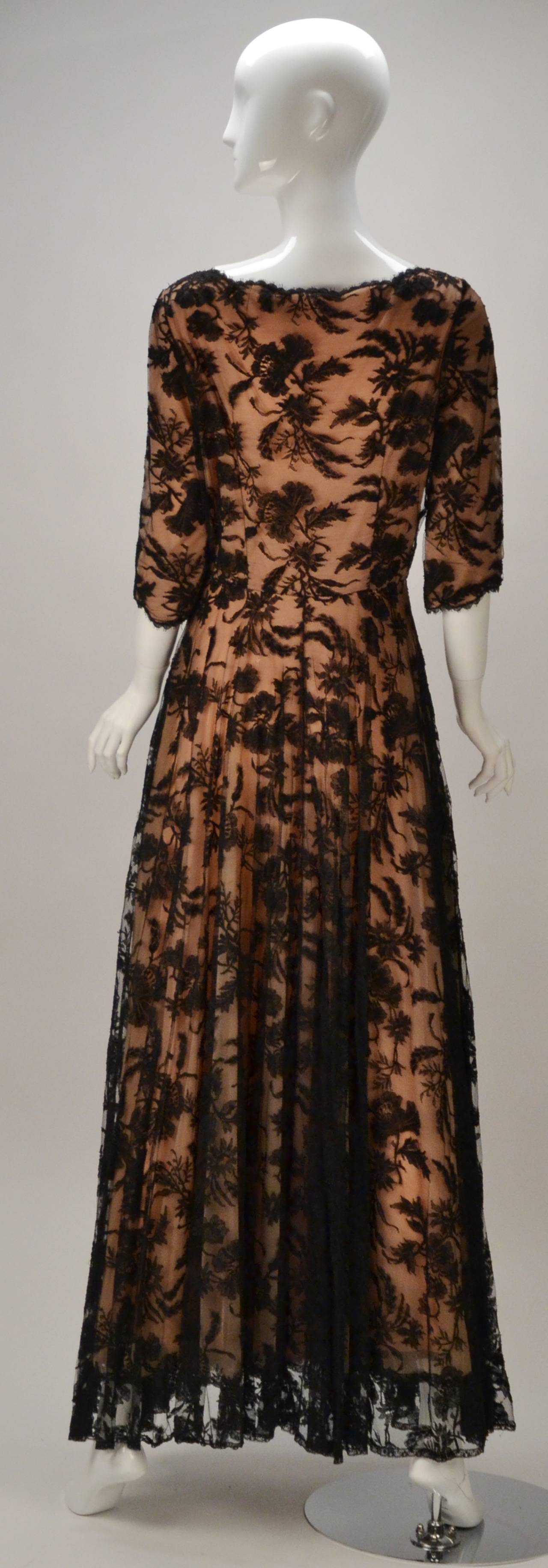Old Hollywood Style vintage gown can easily turn into your dramatic evening out attire. Be the envy of the room wearing this Lucie Ann Gold Label masterpiece. This gown has a nude chiffon shell with black lace overlay that opens perfectly in the
