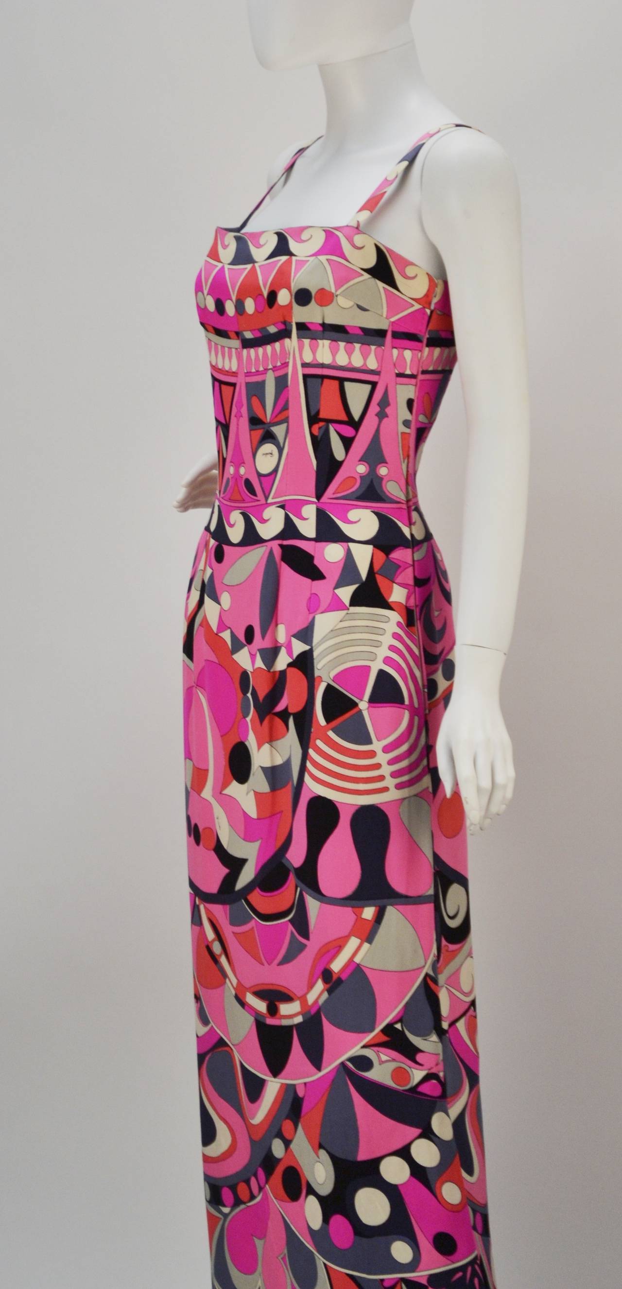 Stunning 1960's Emilio Pucci silk jersey multi-color maxi dress with narrow straps. This is a quintessential Pucci!  Emilio's signature can be seen throughout the vibrant print. The dress fastens with a side-zippered and hook-n-eye closure. The
