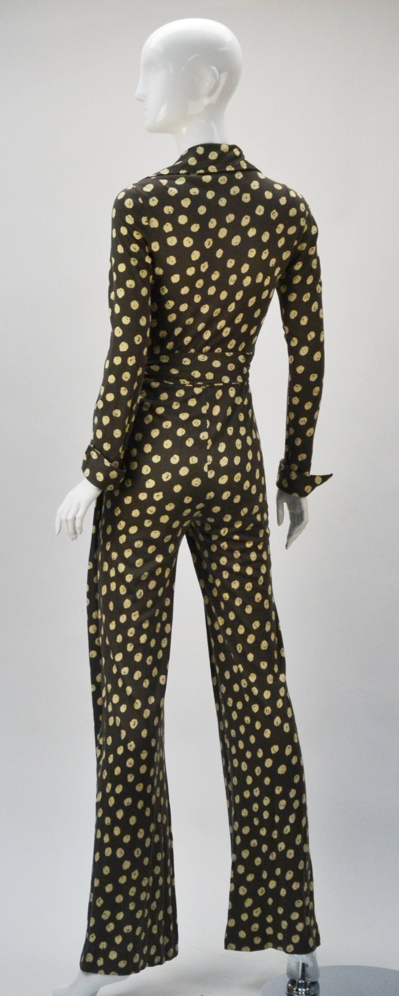 Extremely Rare 1970's Diane von Furstenberg gray with beige polka dots jumpsuit. This garment is amazing!!!  It is both absolutely sexy and comfortable!  A feat not easily captured...unless something you probably don't want showing, showing.  This