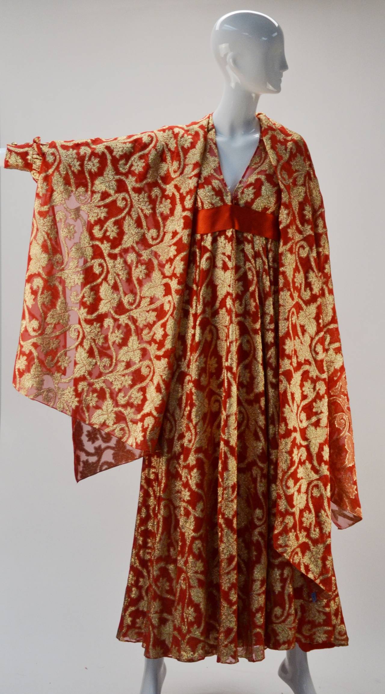 This dress is beautiful!  it is great for all seasons and almost all evening occasions!

Elegant red with gold metallic leaf print evening dress and shawl by Marc Bohan for Christian Dior. The sheer chiffon dress has an attached full slip and