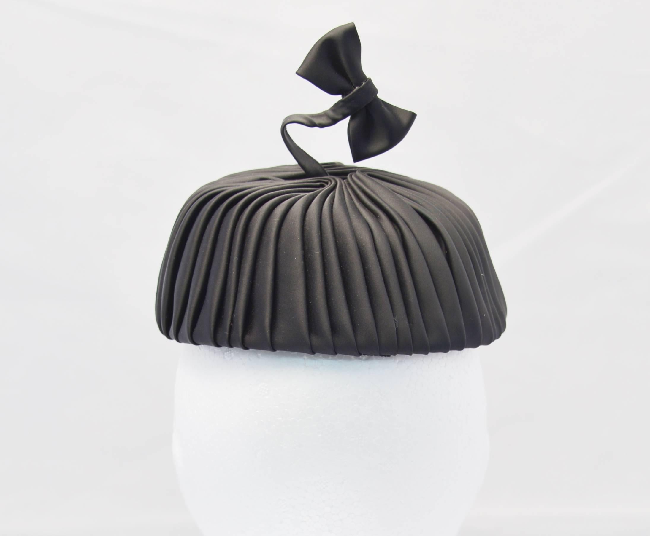 Gray 1960s Sally Victor Black Pleated Pillbox Style Hat with Bow Accent For Sale