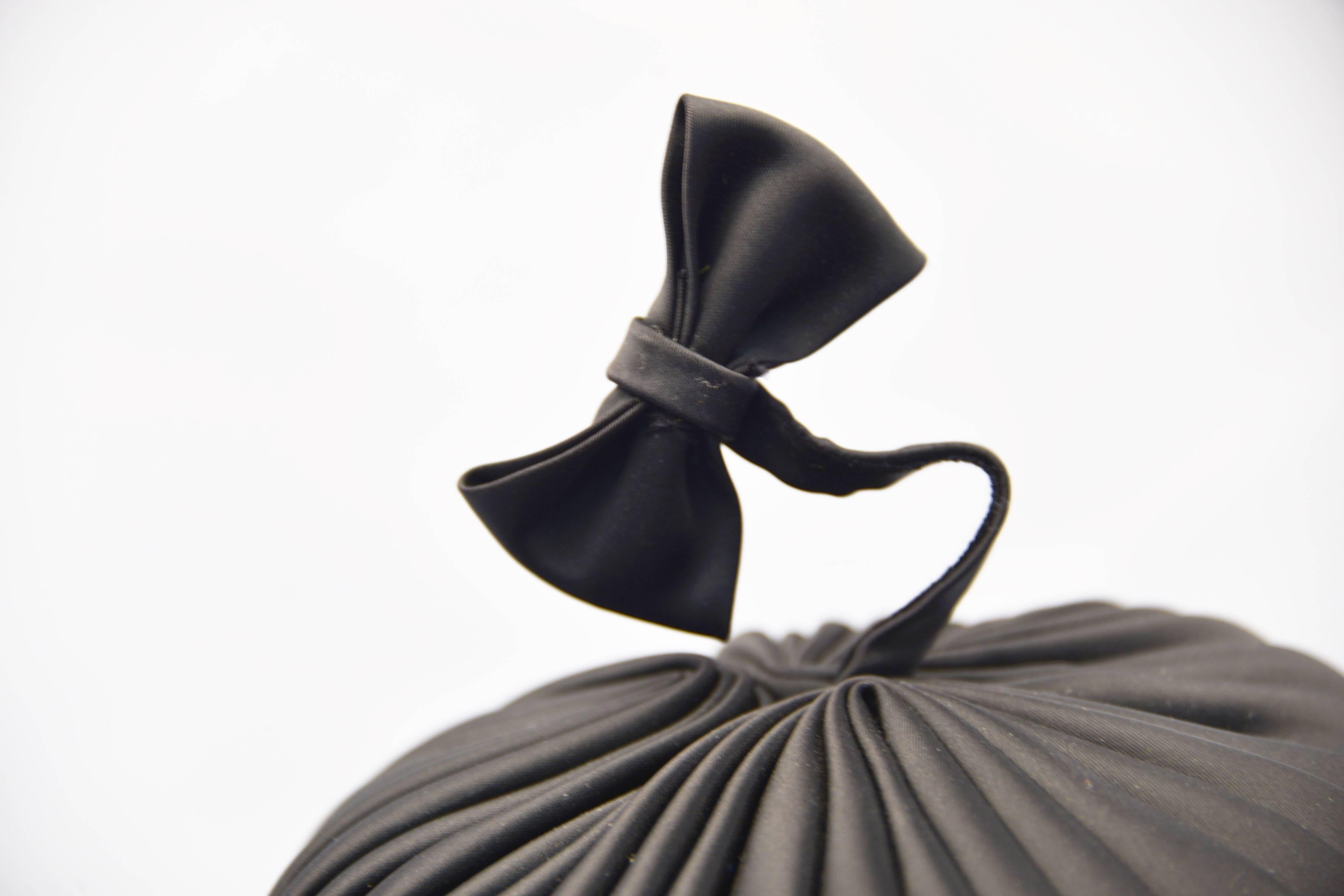 1960s Sally Victor Black Pleated Pillbox Style Hat with Bow Accent In Excellent Condition For Sale In Houston, TX