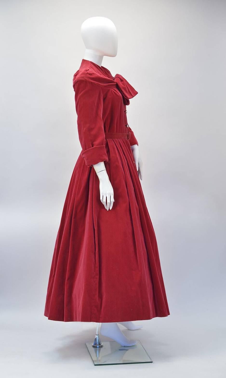 Museum Quality fabulous velvet cranberry 1950's Christian Dior dress. This dress is the epitome of the "New Look" recreated by Saint Laurent during his early years taking over the helm after Dior's sudden death.  While paying homage to his