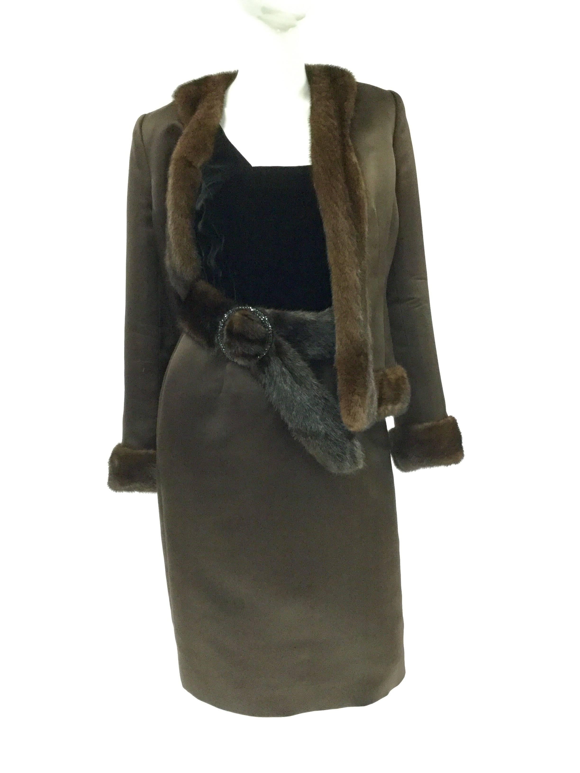 Luxurious Brown satin dress and jacket with mink trim and belt by Oscar de la Renta. Dress bodice is black velvet and sleeveless with square neckline and back. Zips in back. Mink belt with Black rhinestone hoop buckle. Jacket is brown satin with