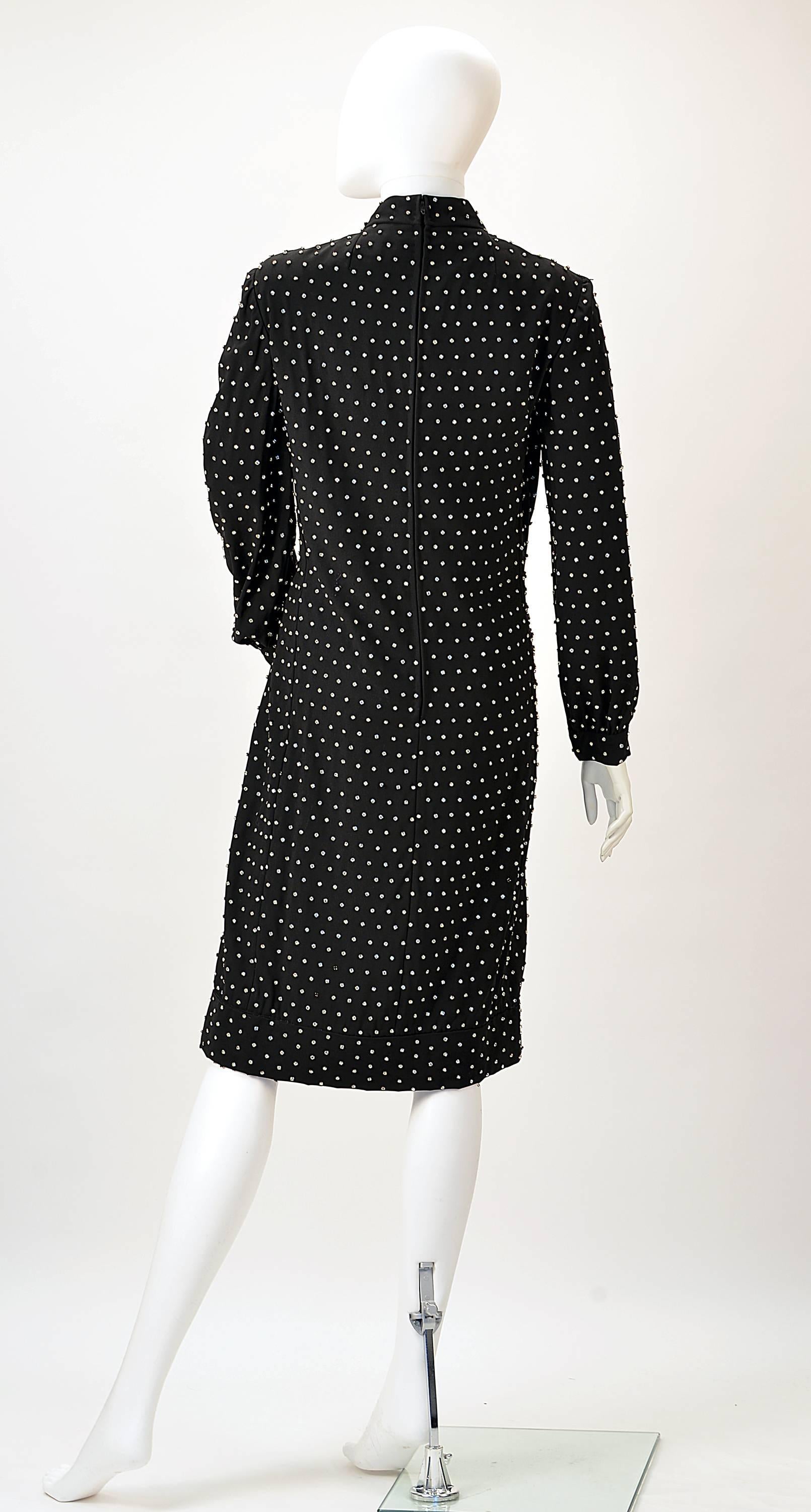 If you are looking for an awesome and comfortable New Year's Dress, this 1960's Marie McCarthy for Larry Aldrich designed dress is it!

Covered with perfectly placed rhinestones, this shift dress is perfect for a cold night when you want to sparkle