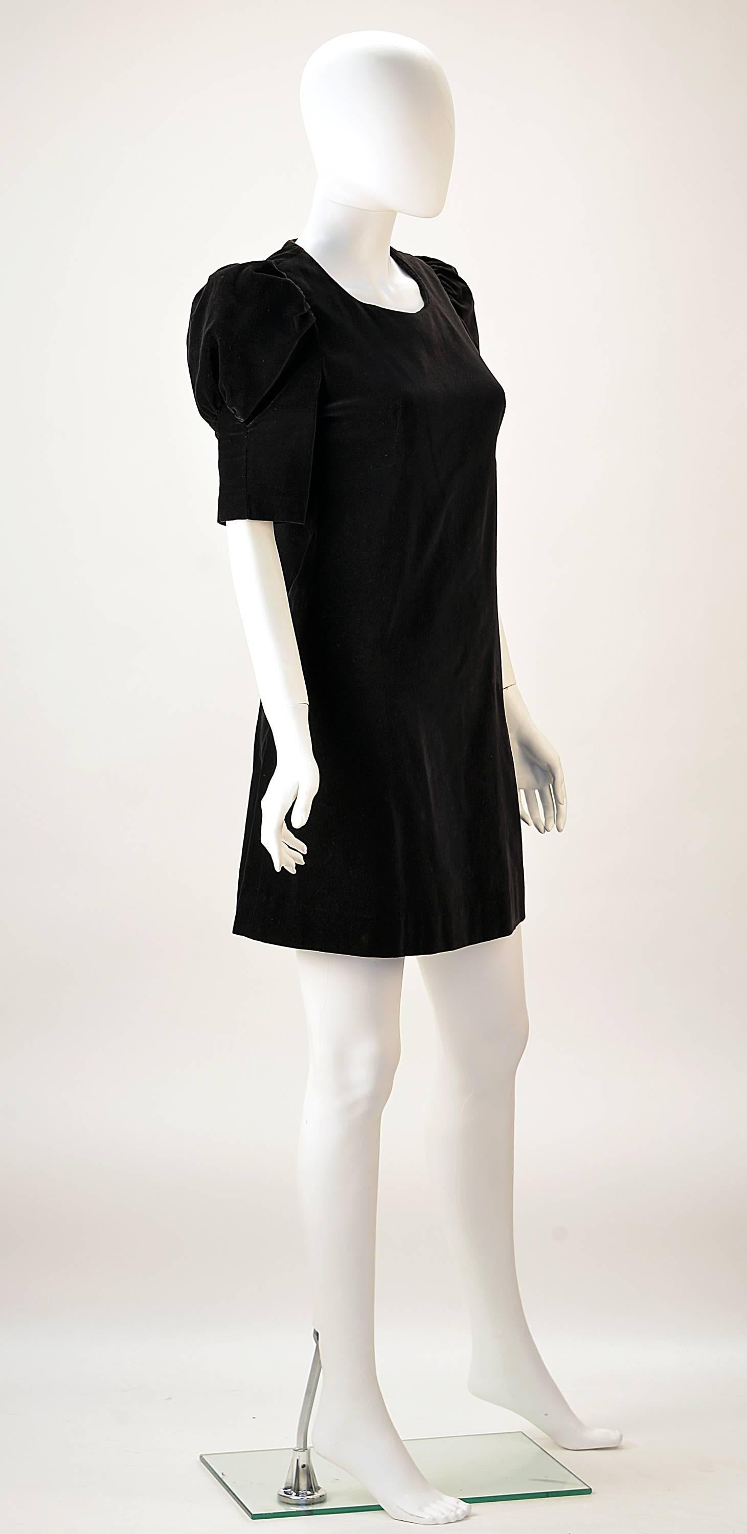 Simply adorable and classic!  This "60's London street wear goes to a Formal" dress, designed Barbara Hulanicki of Biba is made of beautiful black velvet. Perfect for your New Year's Party in any city!  

Mrs. Couture can picture it