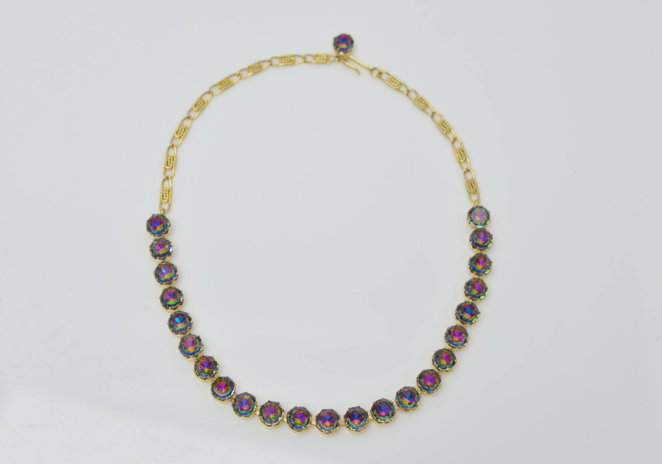 Unbelievable  and iconic Schiaparelli Watermelon Tourmaline colored Parure surviving from the mid 1950's consisting of 1 stamped necklace, 1 stamped bracelet & 1 stamped pair of clip earrings.Gold plated and prong set throughout.
A phenomenal