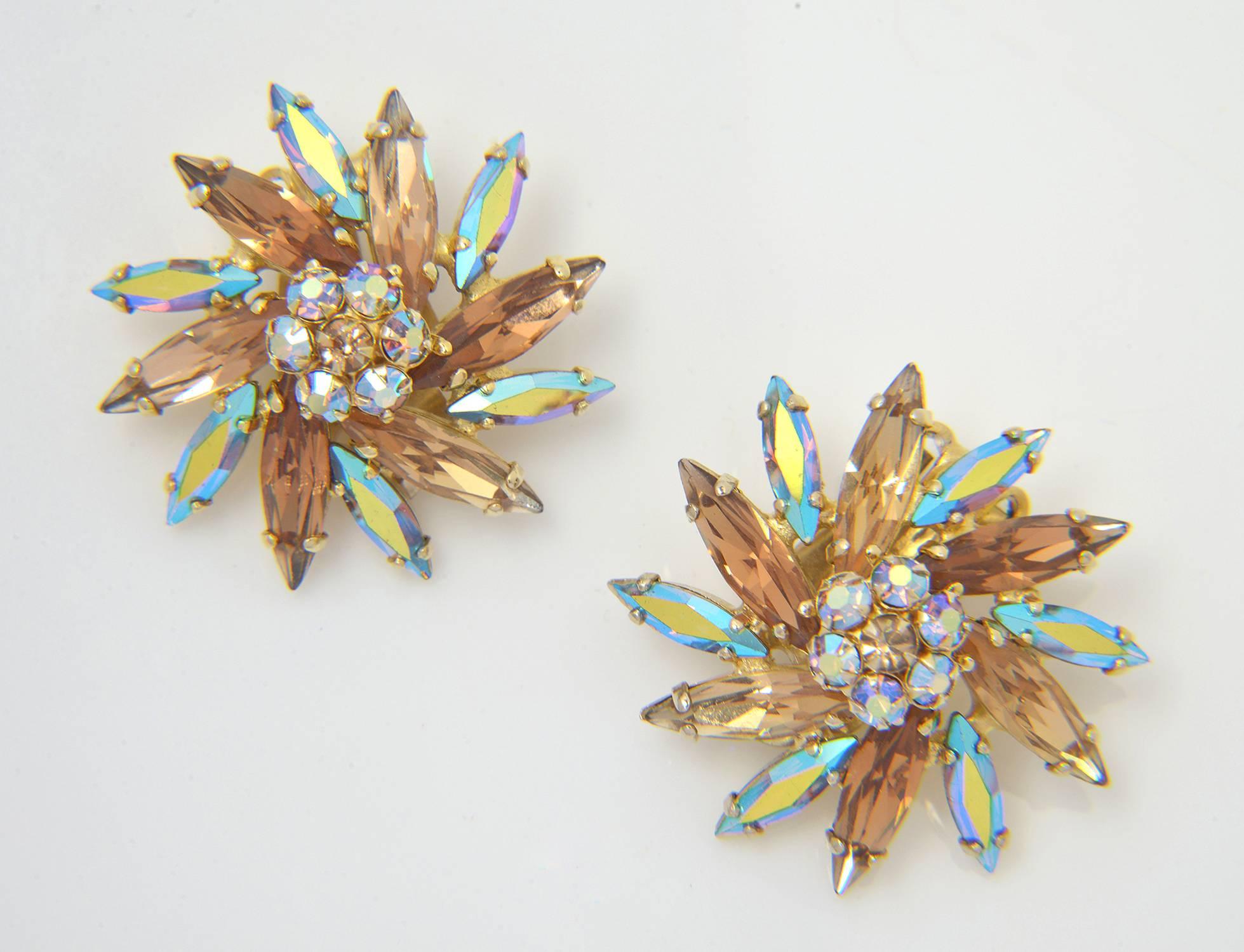 This 1950's signed by Sherman aurora borealis coated brooch comes with matching clip-on earrings. They are quite easy to have made into pierced earrings as well.  The set twinkles with lovely champagne and topaz hues.

Sherman, whose slogan was