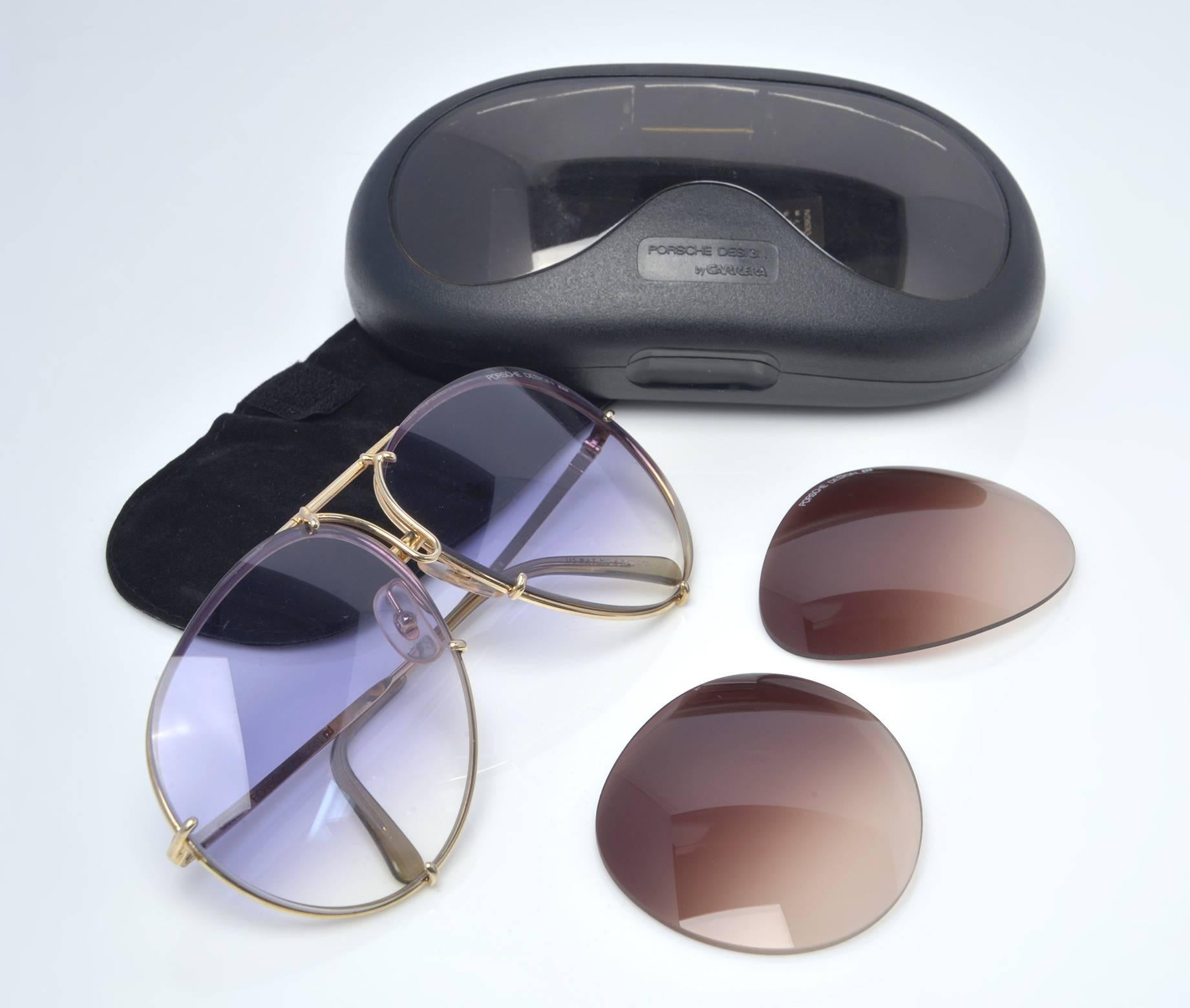 These classic 5621 Porsche design by Carrera sunglasses combine gold and silver titanium frames with a very rare blue gradient lens and come with a second set of brown gradient lenses which are quite rare as well.

1980's Porsche sunglasses were