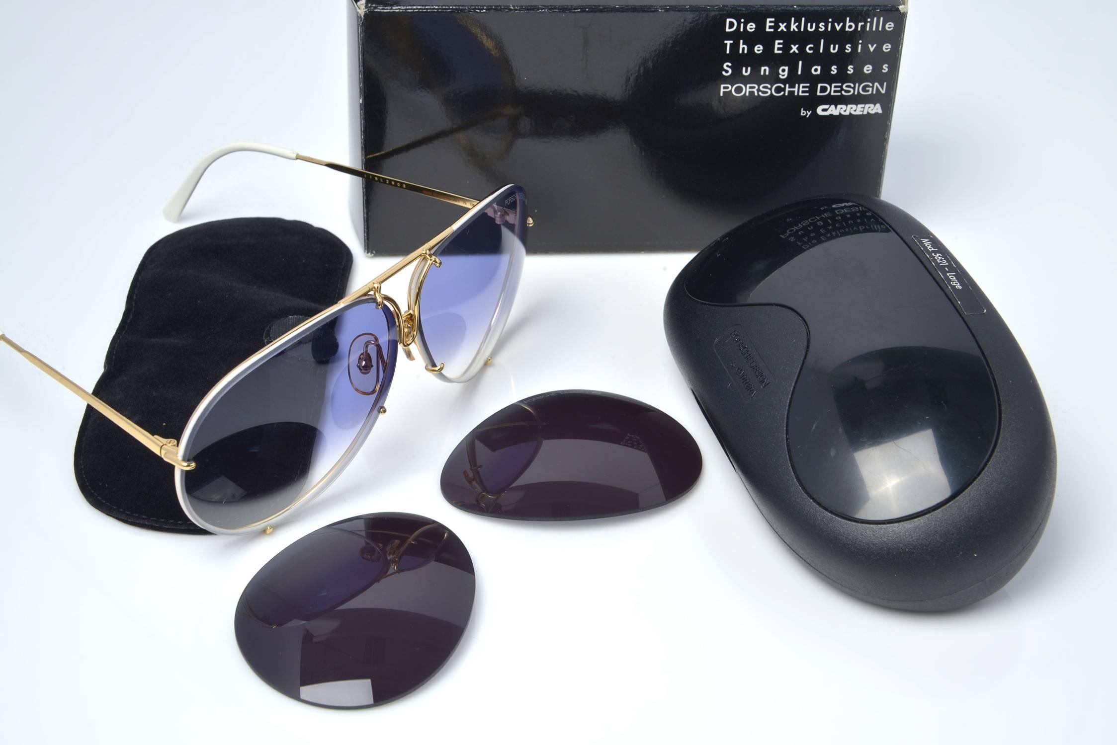 Extremely rare and coveted by collectors comes these New Old Stock, 1980's Porsche Design by Carrera model 5621 aviator sunglasses.  

In addition to being unworn, they come in their hardcover case and with replacement lenses. 

The gold framed