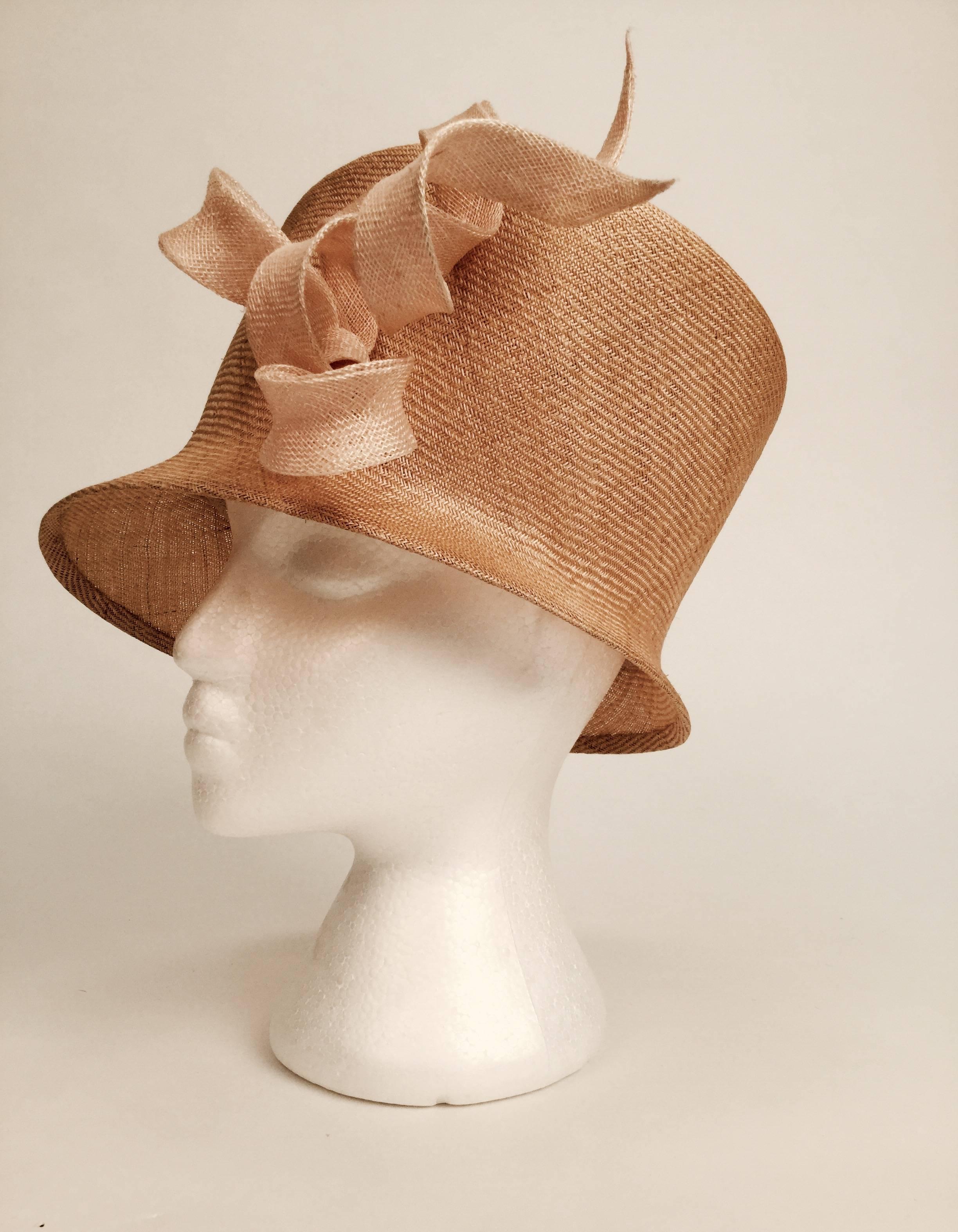 Philip Treacy is known all over the world for his exceptional millinery work. Royalty and celebrities flock to wear his creations. 

This beige, straw hat is one of his masterful creations -- one that has apparently never been worn.

We believe