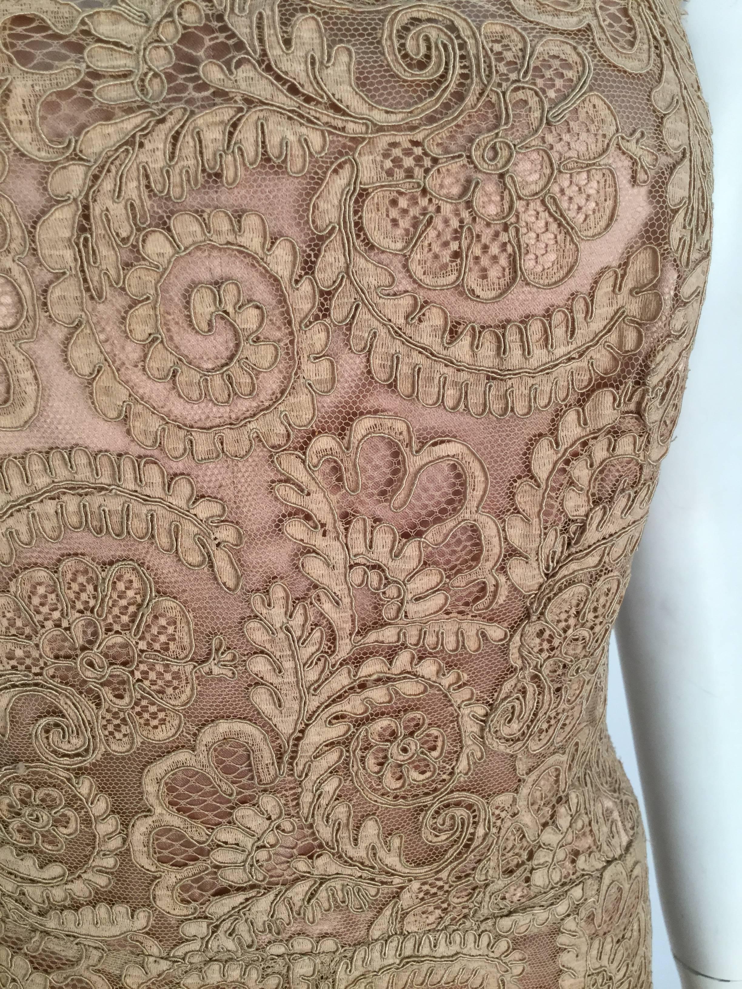 Elegant nude strapless Venetian lace floor length evening gown.  Couture quality craftsmanship, perfect fit and wonderfully preservation. 

Subtle and simple fit and flare silhouette but with fine venetian lace.

Bodice has boning for support.
