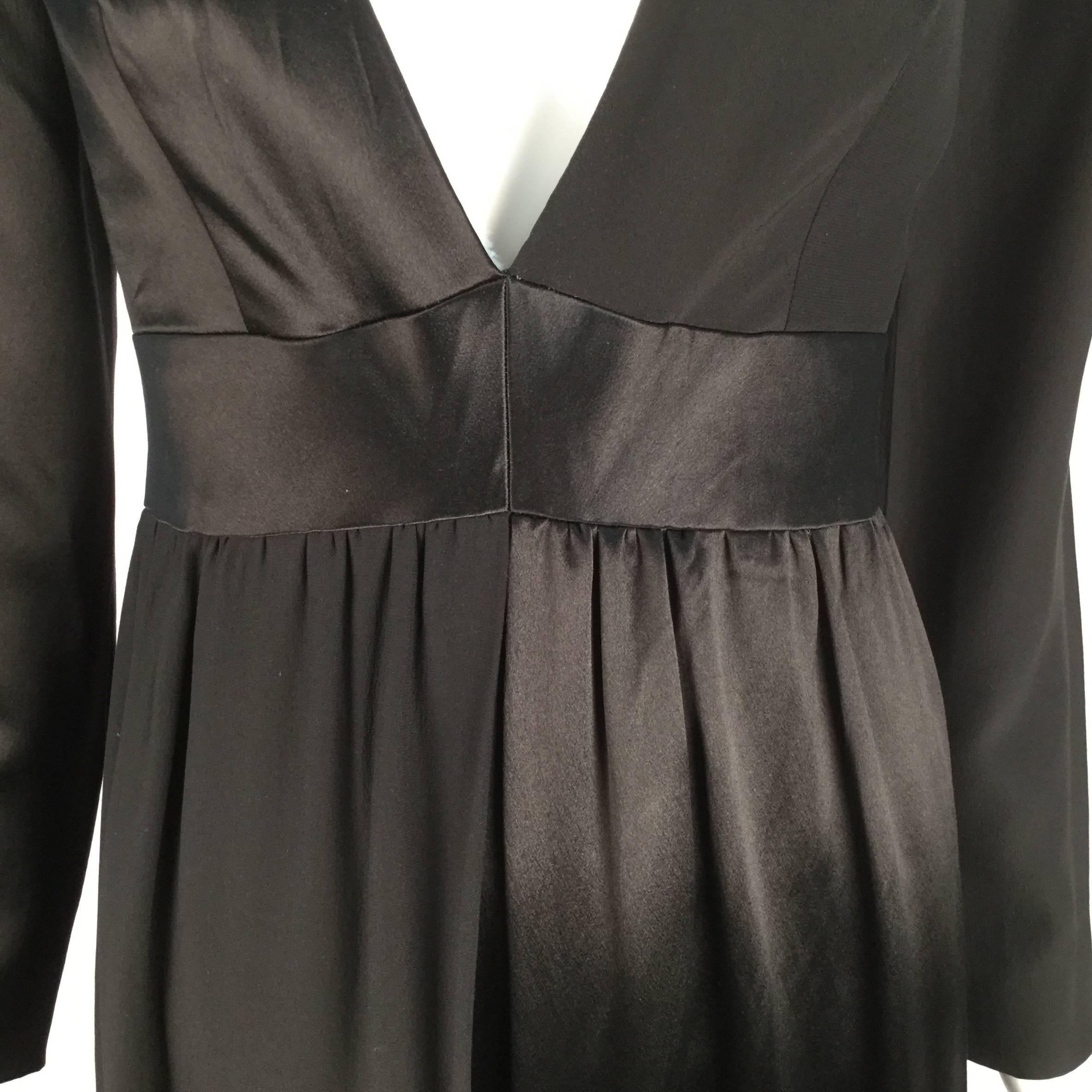 
Uber chic and sexy early 70's Emilio Pucci black fabric blocked jumpsuit.  Absolute comfort as well, in this silk and silk satin creation.  The top right and bottom left panels are silk fabric, left top and right bottom panels are silk satin.  V
