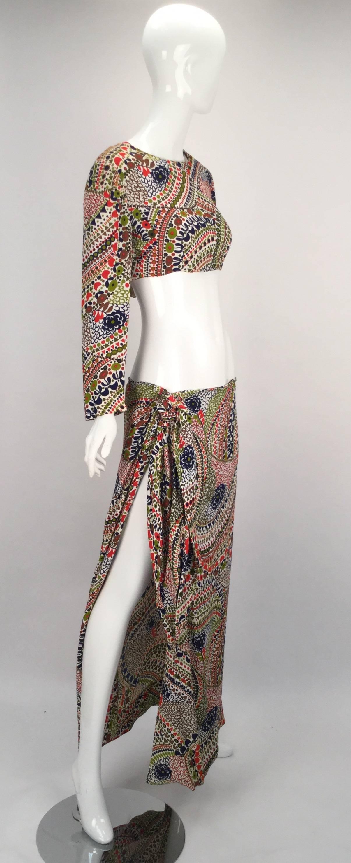 Signed and numbered 017113351, this Christian Dior Boutique three piece beach set from the 1960's is one of a kind!!!  Wonderful ethnic, meets mod, meets bohemian print used throughout this magnificent piece of work. 

A crop beach top featuring a