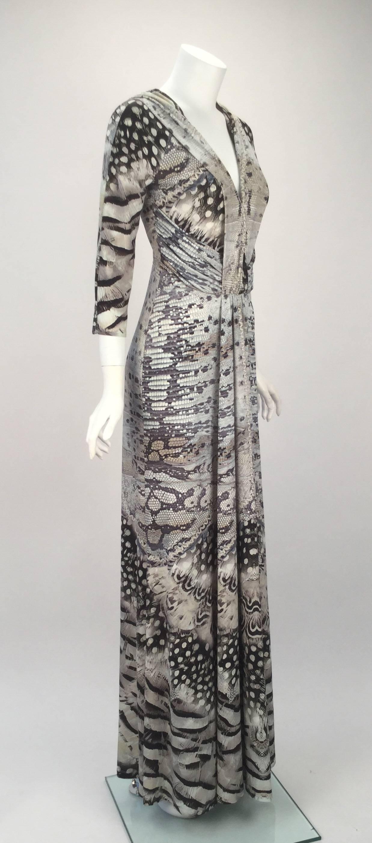 Roberto Cavalli 2000s contemporary long-sleeve lizard print dress. The stretch knit wear fabric features Cavalli's signature, as well as his signature exotic lizard and feather print. The dress' silhouette hugs the body and flows out at the hips. A