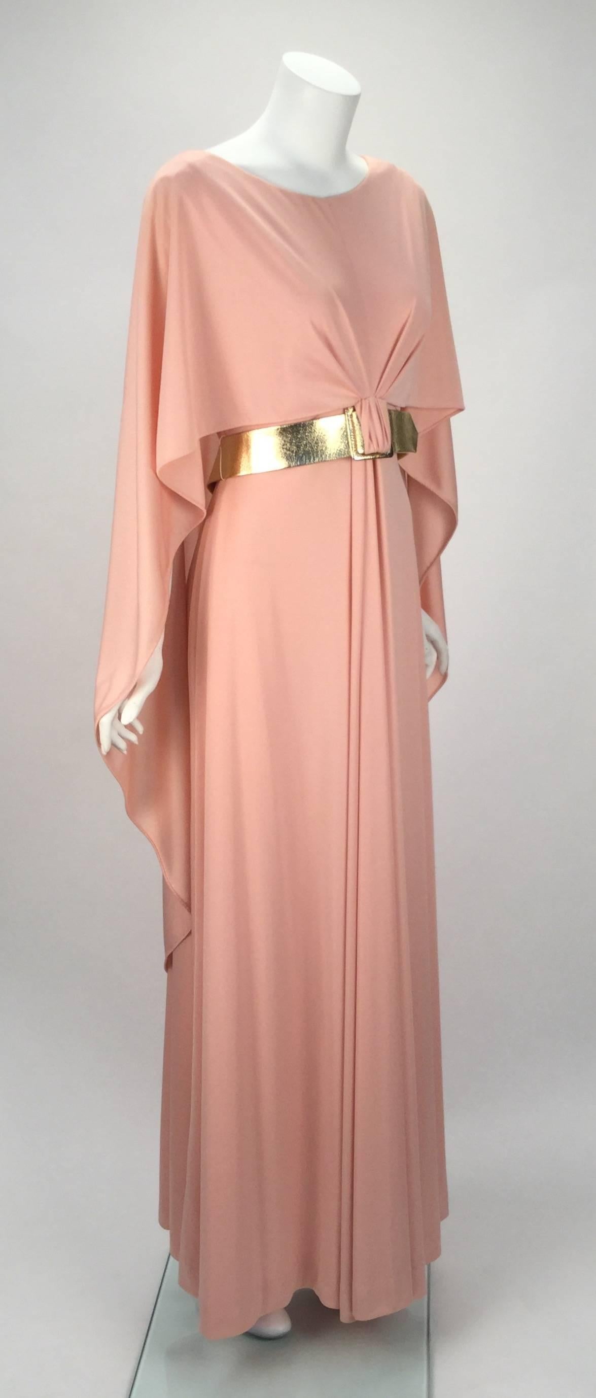
Wonderful 1970s new with tags pale pink long knot wear evening dress from Estevez for his 