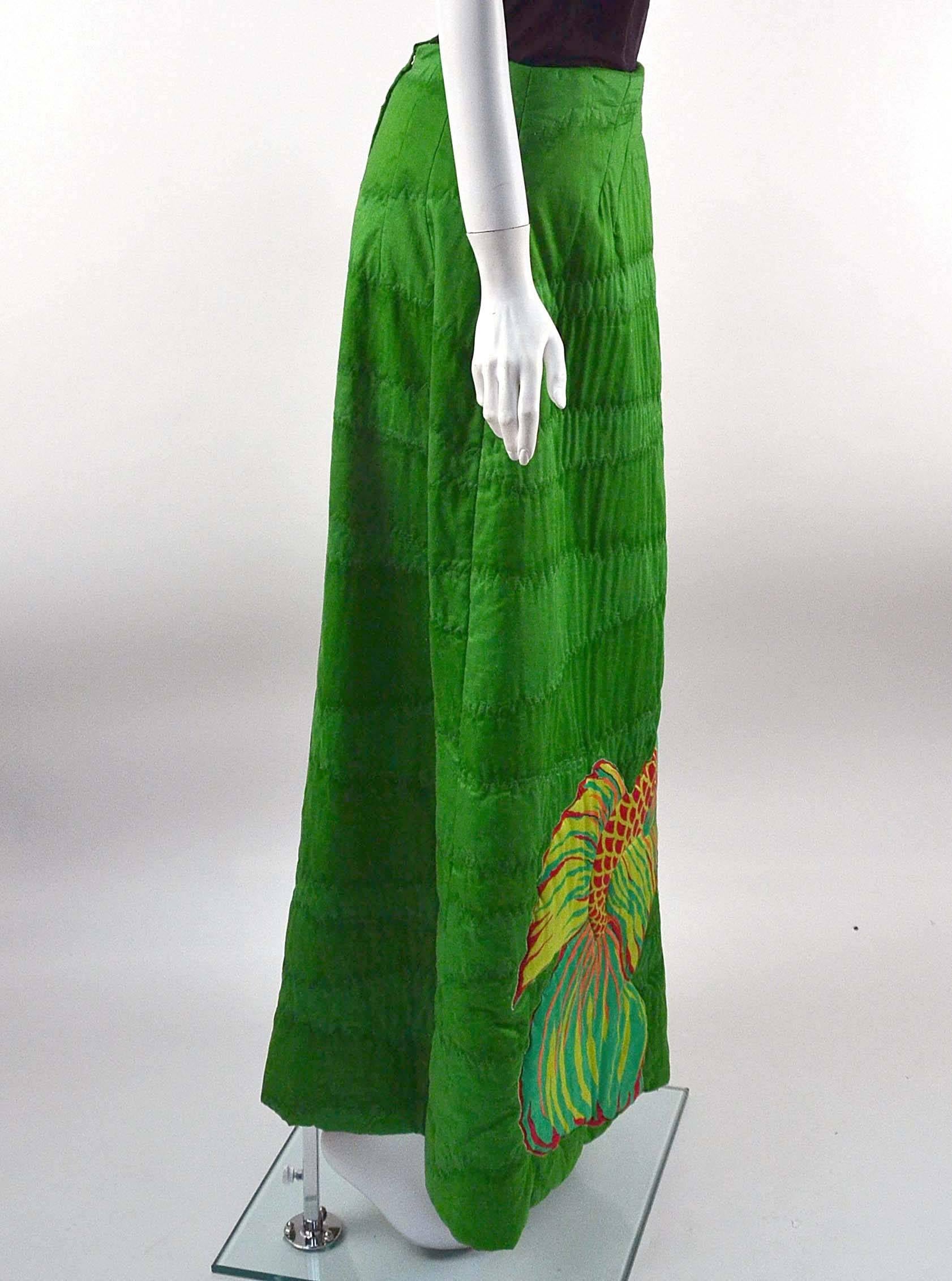 Wonderfully fun and beautiful, 1970's green maxi skirt with hand screened fish print by Design Thai 12 of Bangkok. The skirt also features a zig-zag top stitching with a wavy watered border technique, adding more uniqueness to the overall design.