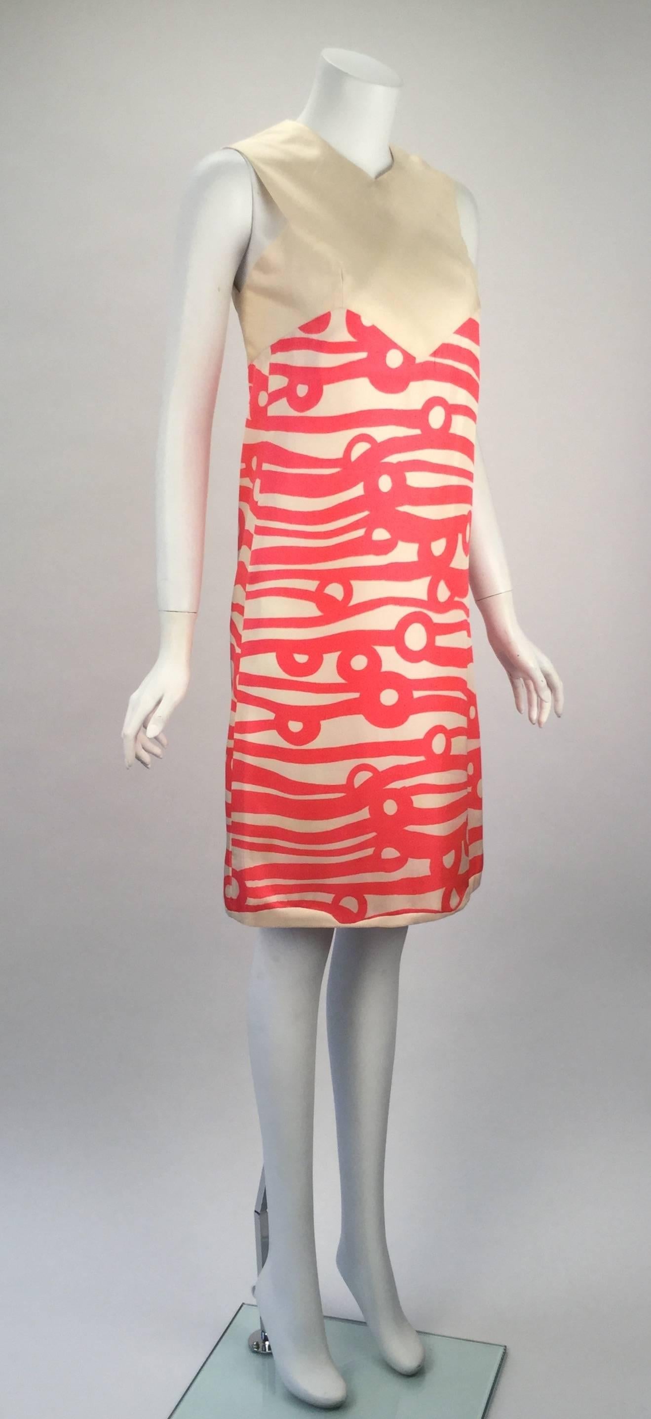Wonderful and fun with bright colors comes this silk shift dress.  Abstract print is bright pink on off white silk. Bust darts create nice bust line on off white raw silk twill that is cut on the bias. Wavy slight hem in the same raw silk twill.