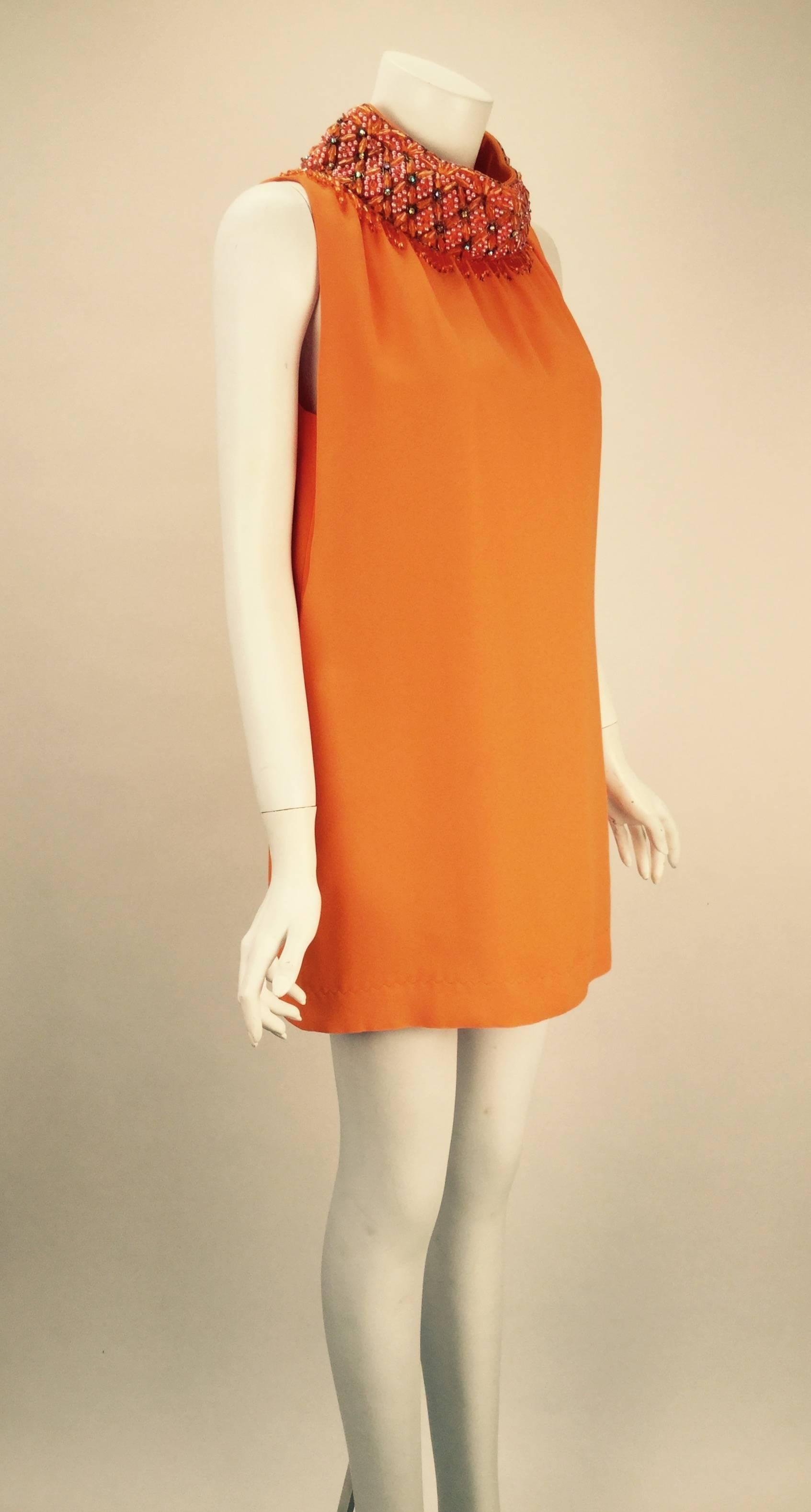 Fantastic and unique 1960s Gino Charles by Malcolm Starr orange ultra mini dress with a wonderful 