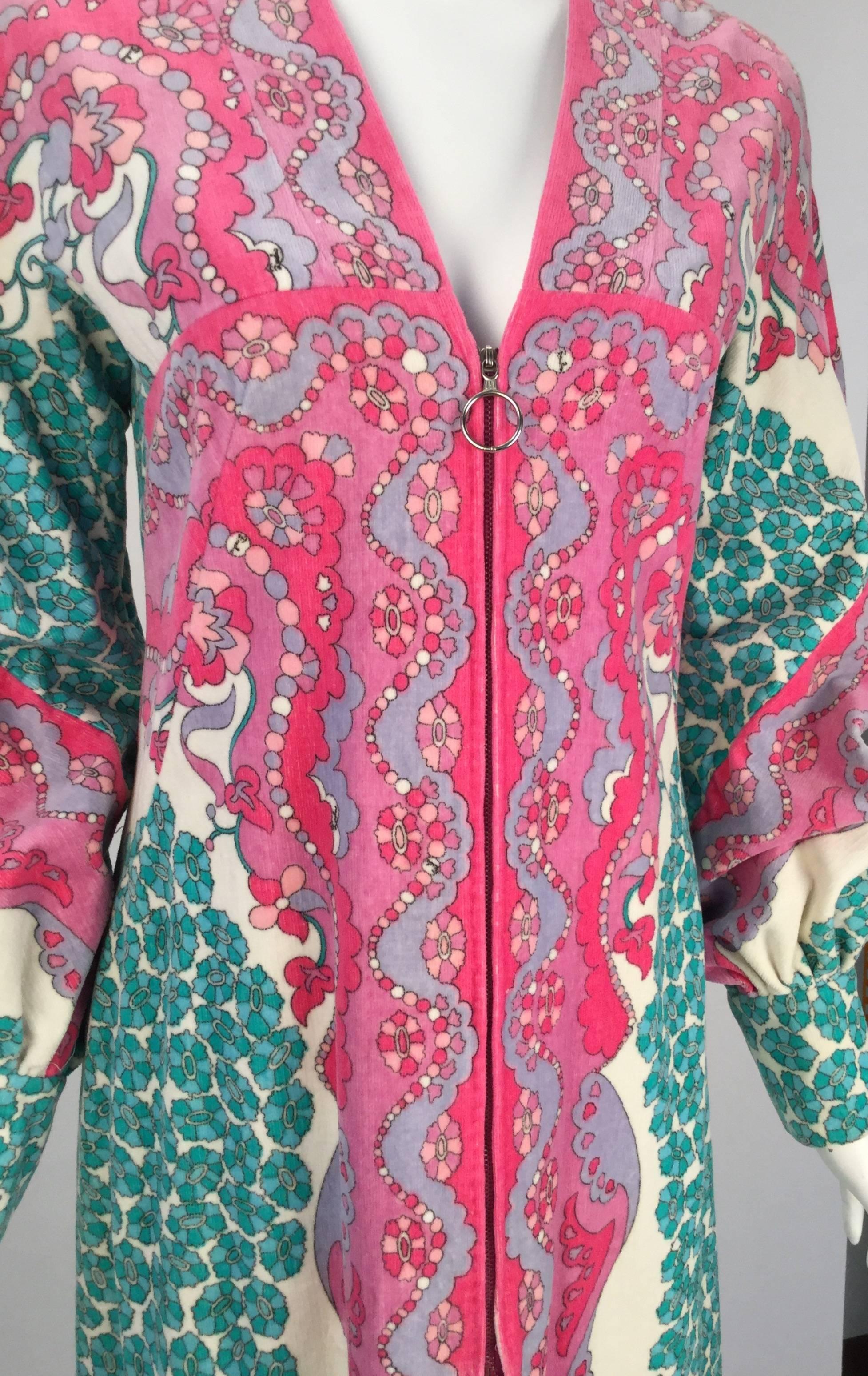 Vibrant 1960s Emilio Pucci terry cloth multi-color caftan. It is so versatile, it can also be donned as a beach cover after a cold dip in the ocean on a summer day and worn to dinner in the evening. 

 The long sleeves are cuffed, with three snap