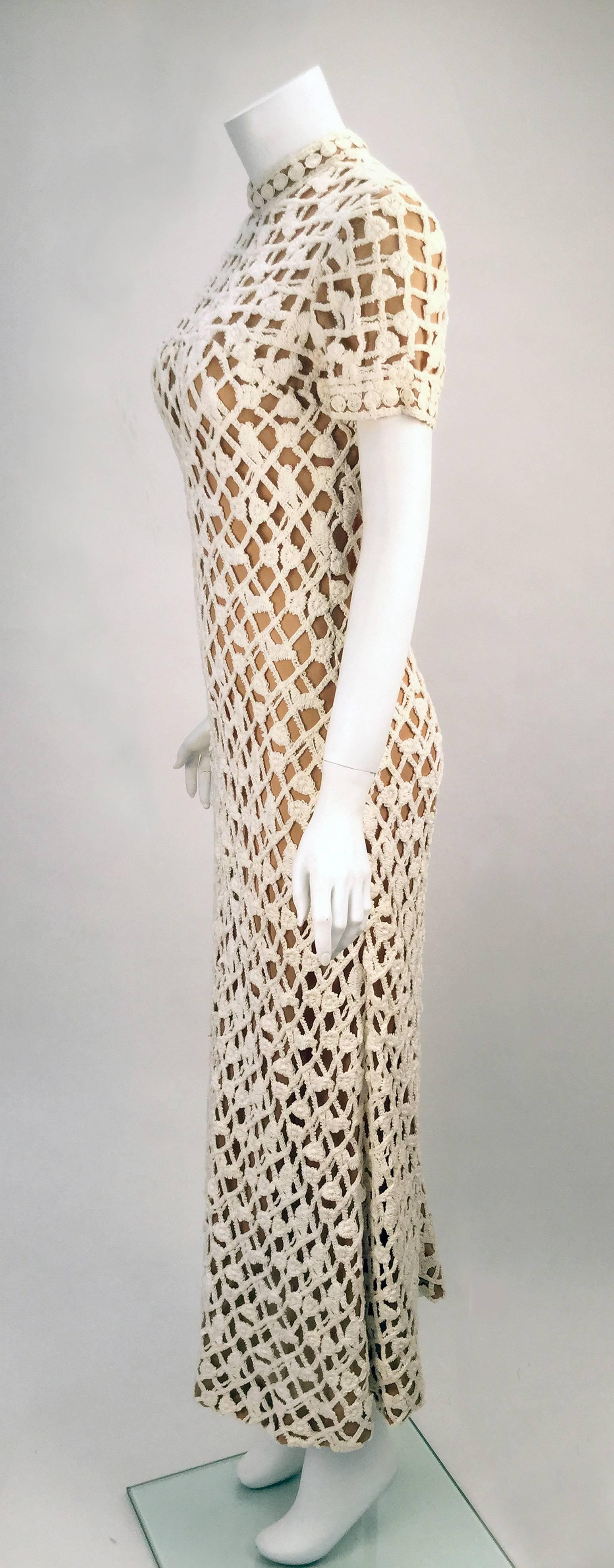 Chanel those 70's summers in this bohemian lace short sleeve dress by Pat Sandler.  A nude semi-sheer lining underneath the intricate lace detailing provides a hint of what is underneath.  Wonderful standing collar.  Zipper and two hook and eye
