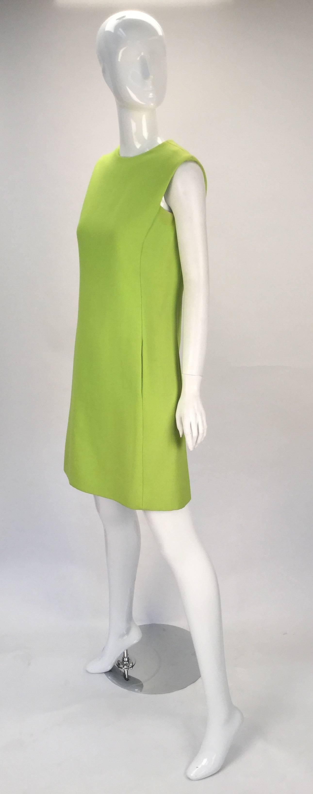 Absolutely radiant and fun, anytime of year or time of day, this 1960's lime green cotton blend sleeveless shift dress by the brand- Joan Leslie for Kasper is sure to brighten up your closet. There are two hidden side pockets. Dress is fully lined.
