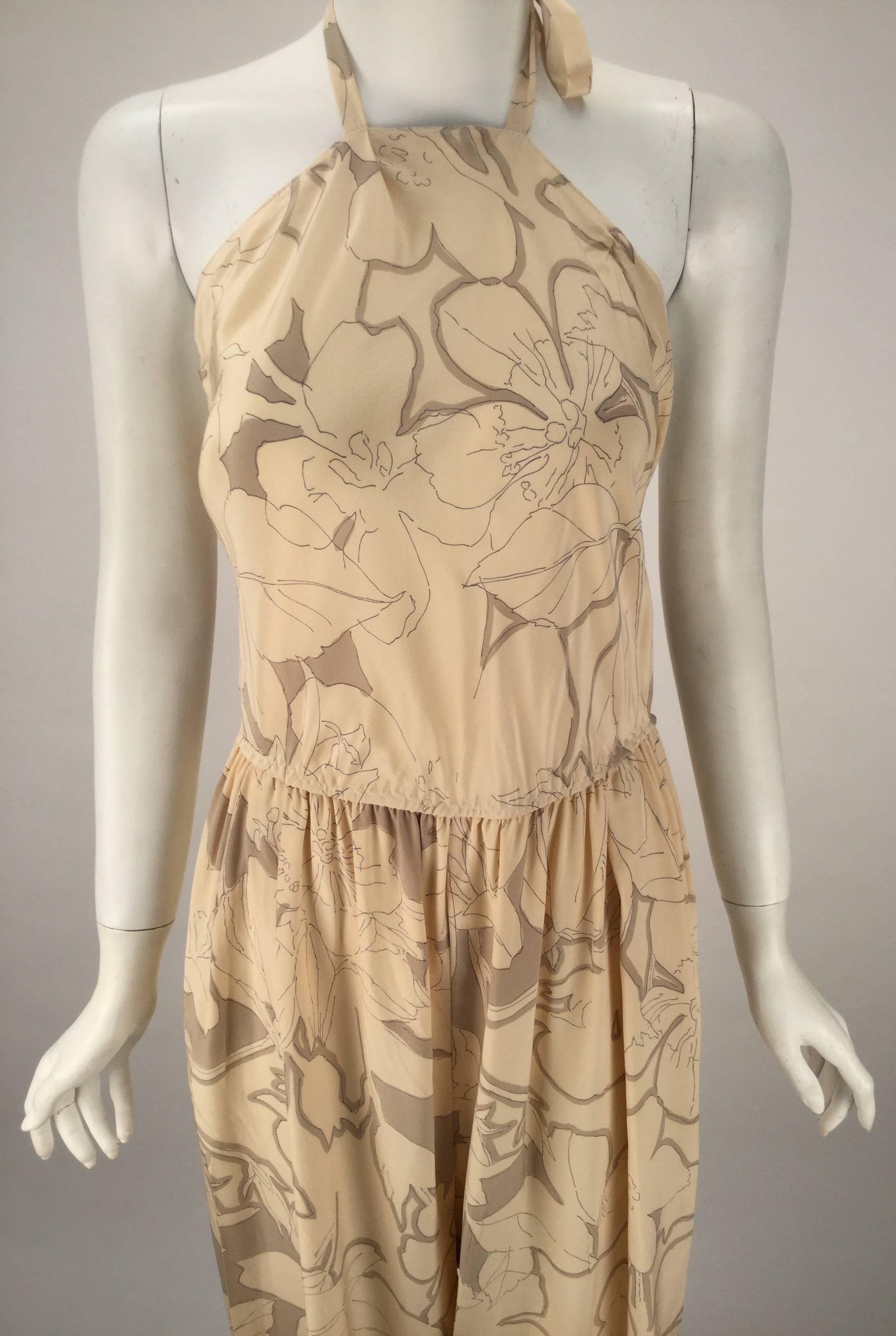 Fantastic and uber comfy 1970's Stephen Burrows silk cream and light brown jumpsuit. Lined. Perfect for day or evening.  Ready for the beach or any dance floor.  We think its low halter back requires a Studio 54 floor, a hip hop groove and some