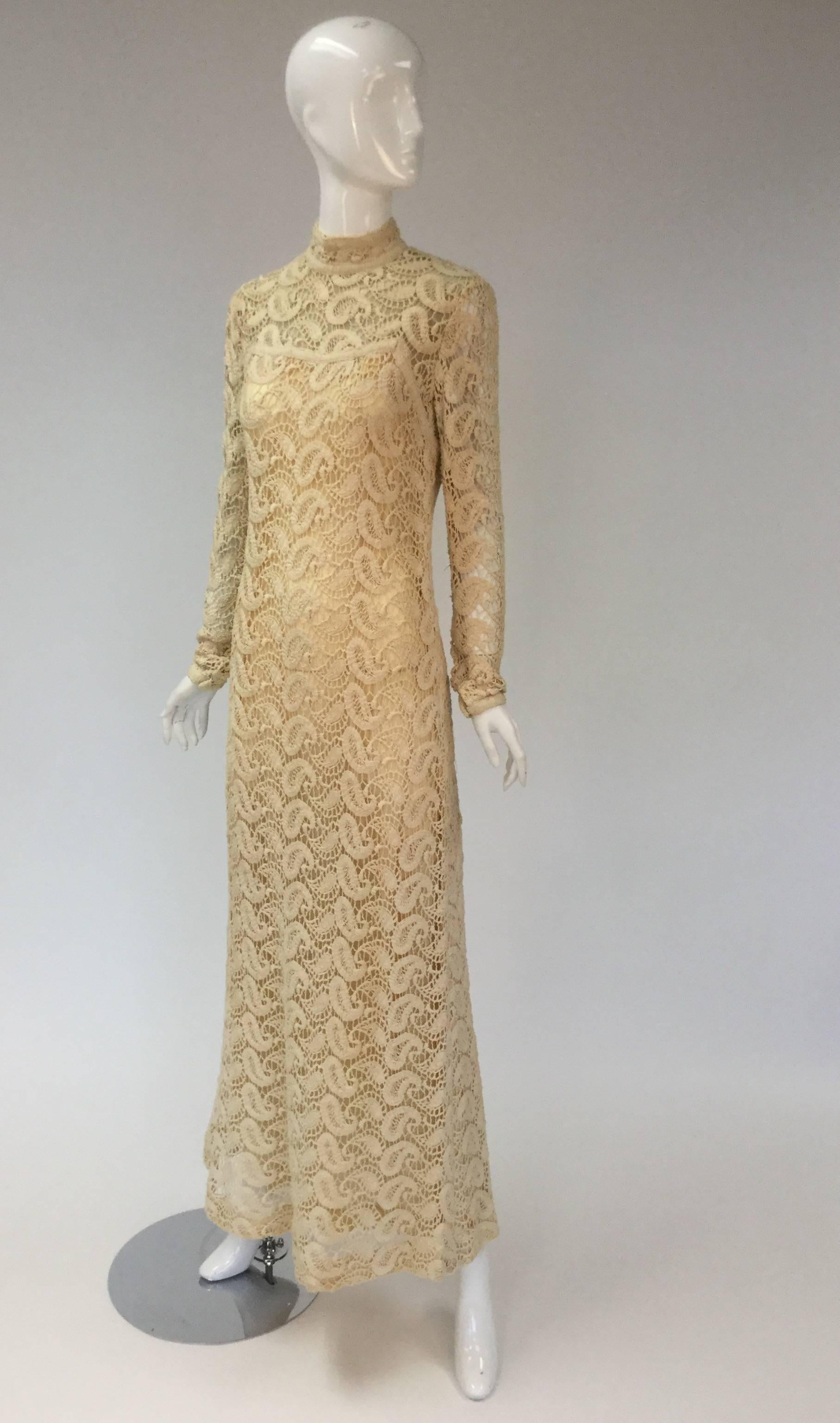 Beautiful Ivory paisley crochet dress from Fred Perlberg Originals.  Boho chic with a modest vibe because of the dress' high neckline with flattering straight silhouette.

Lined from neck down, and a double lining from the bust to floor. Unlined