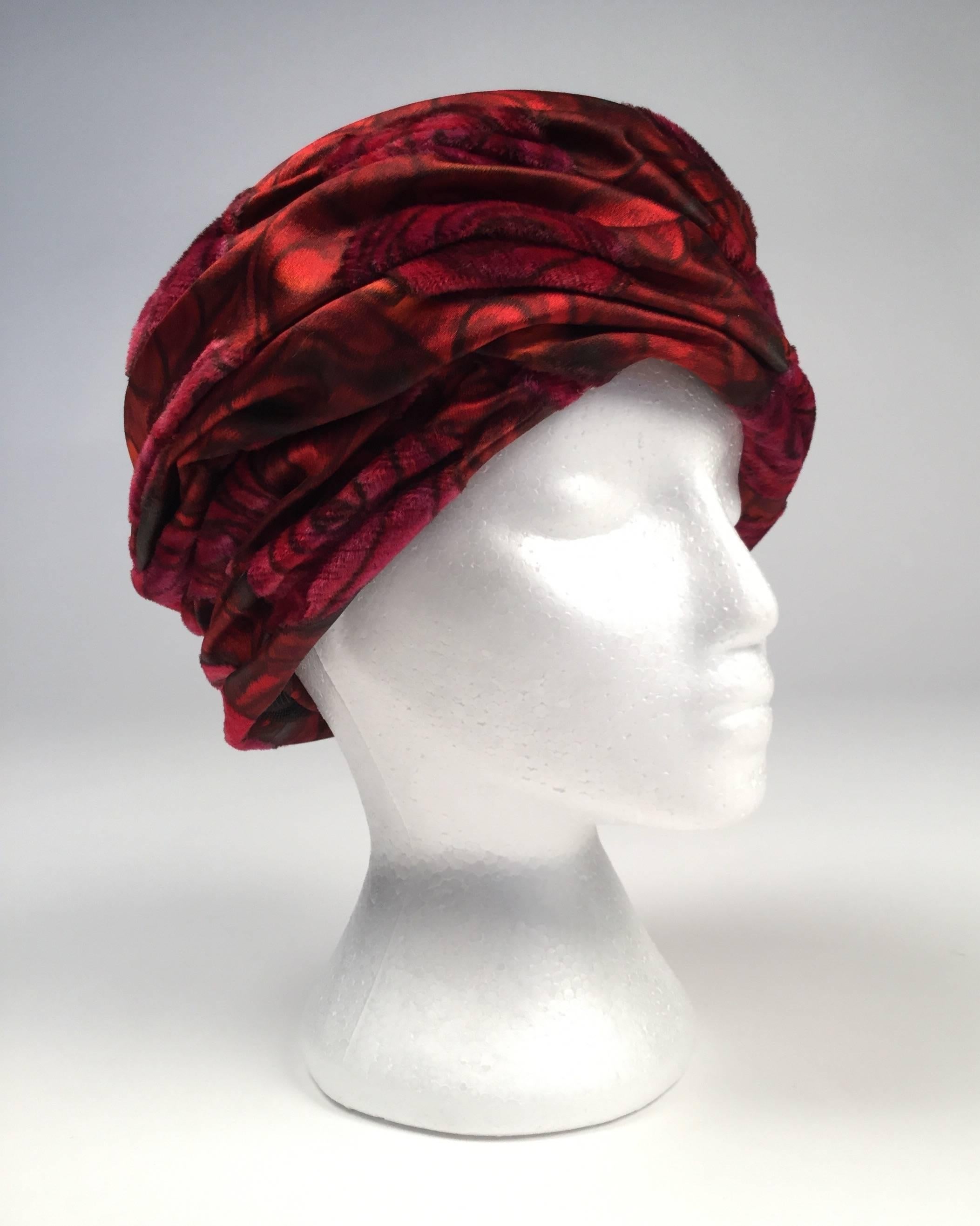Vintage Christian Dior Red Rose Chapeaux. Roses are velvet and a different texture than the rest of the hat that is also velvet with a shorter pile.  Lining is Oxblood red silk grosgrain fabric.

Hat is 21"

*All garments and accessories have