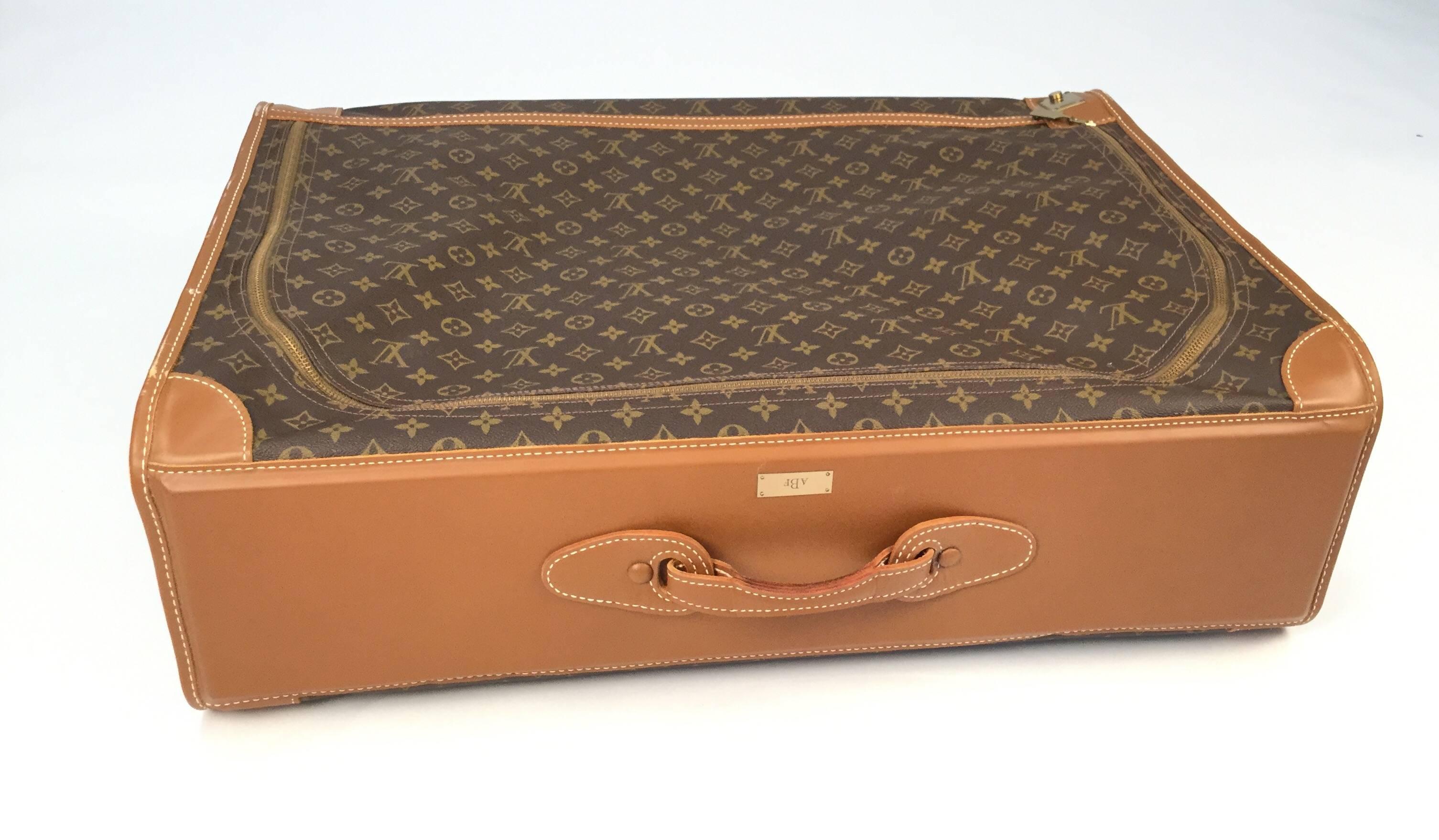 
An authentic late 20th century Louis Vuitton Soft-Side case with a brass plate monogrammed.  Gorgeous in it's own right, comes with a leather designer handle. Has a full length zipper with a key lock and keys with leather case. Leather trim.