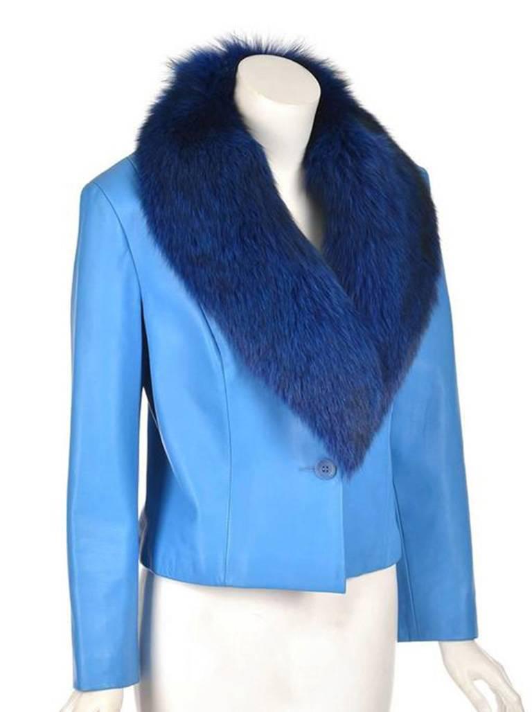 
Edgy Michael Hoban leather jacket. This stunning sapphire blue jacket is made complete with a fox collar dyed to match! The jacket has a tapered waist and features two buttons. The collar is detachable. Striking!

Wrist: 11 1/4 inches

*All