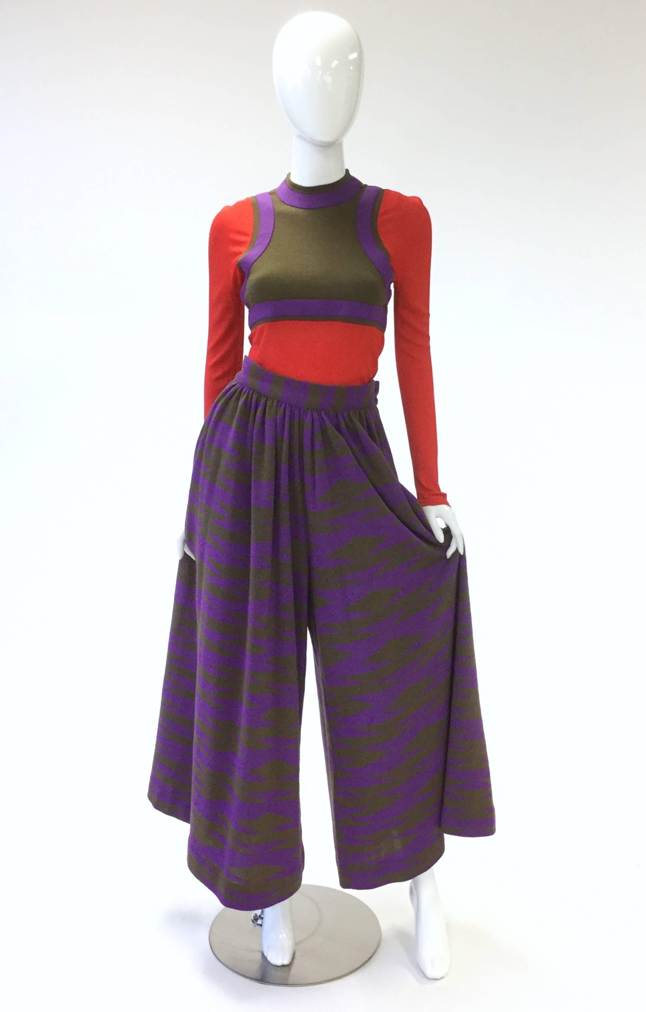Very striking 1960s Rudy Gernreich for Harmon Knitwear top and culottes set. The top features long, red knit sleeves, red knit stomach panels, and a crew neck, as well as purple and olive wool panels creating the illusion of a layered crop top