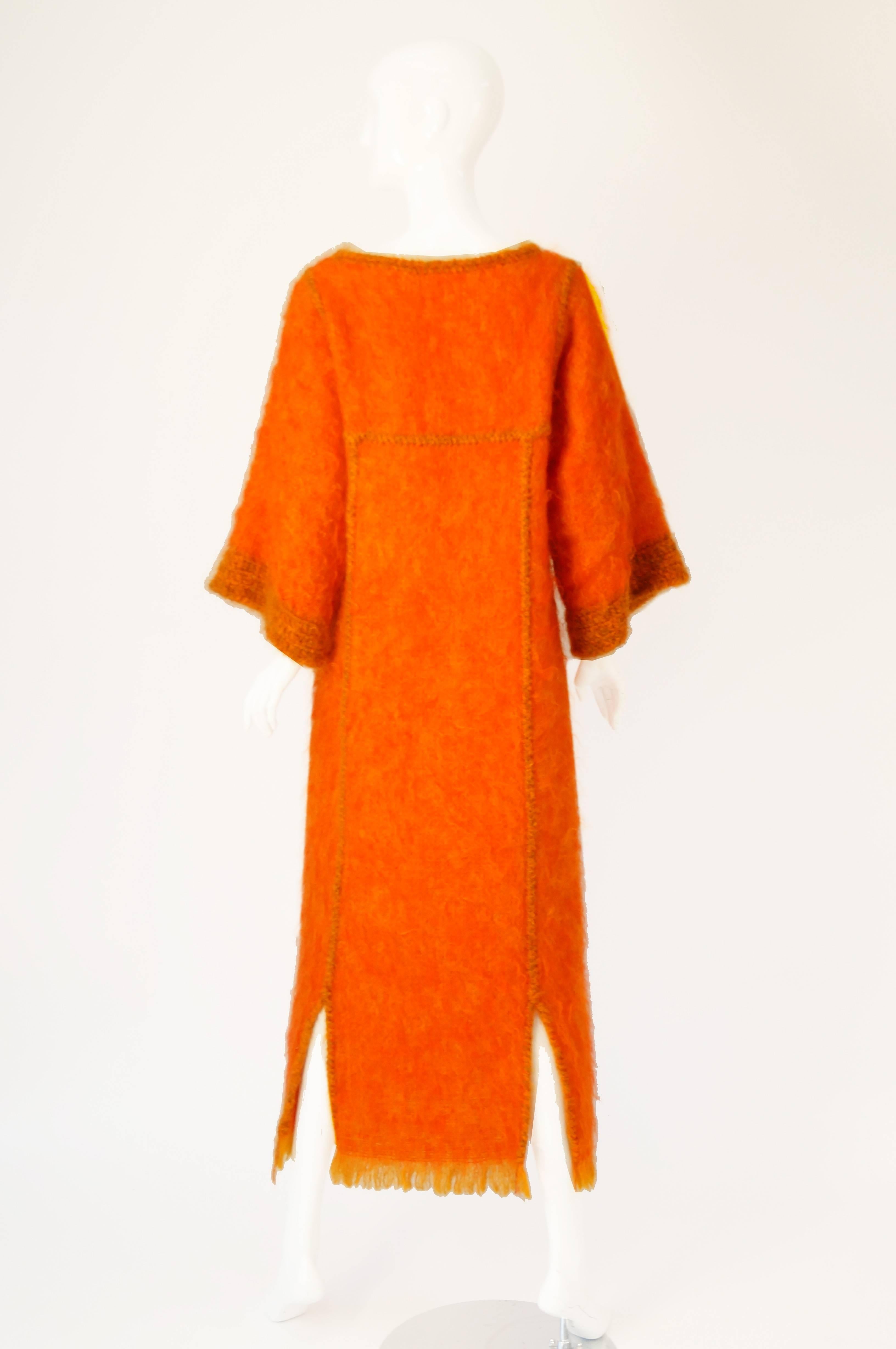 Add a little color to your winter weather wardrobe with this great tangerine mohair caftan/dress by Atelier Jacque d'Aubres.  Known for her handmade clothing Mme d'Aubres has created a beautiful piece of art with this bright creation.

The tangerine