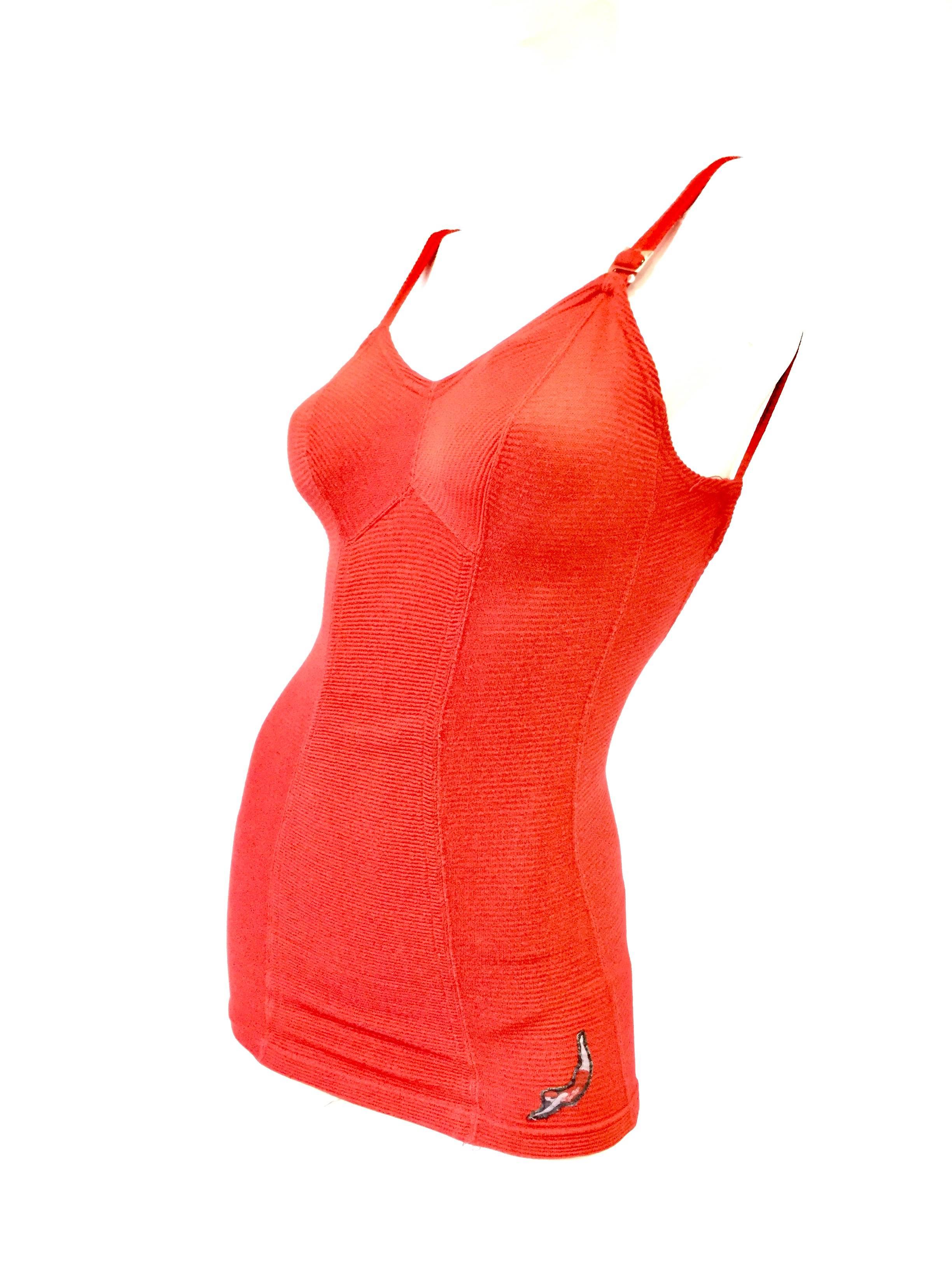 
Gorgeous red bombshell swimsuit by Jantzen! This one piece rib knit pattern suit is composed of several panels arranged in a flattering combination that emphasizes the wearer’s waist. The suit, with its long and fitted attached top resembles a