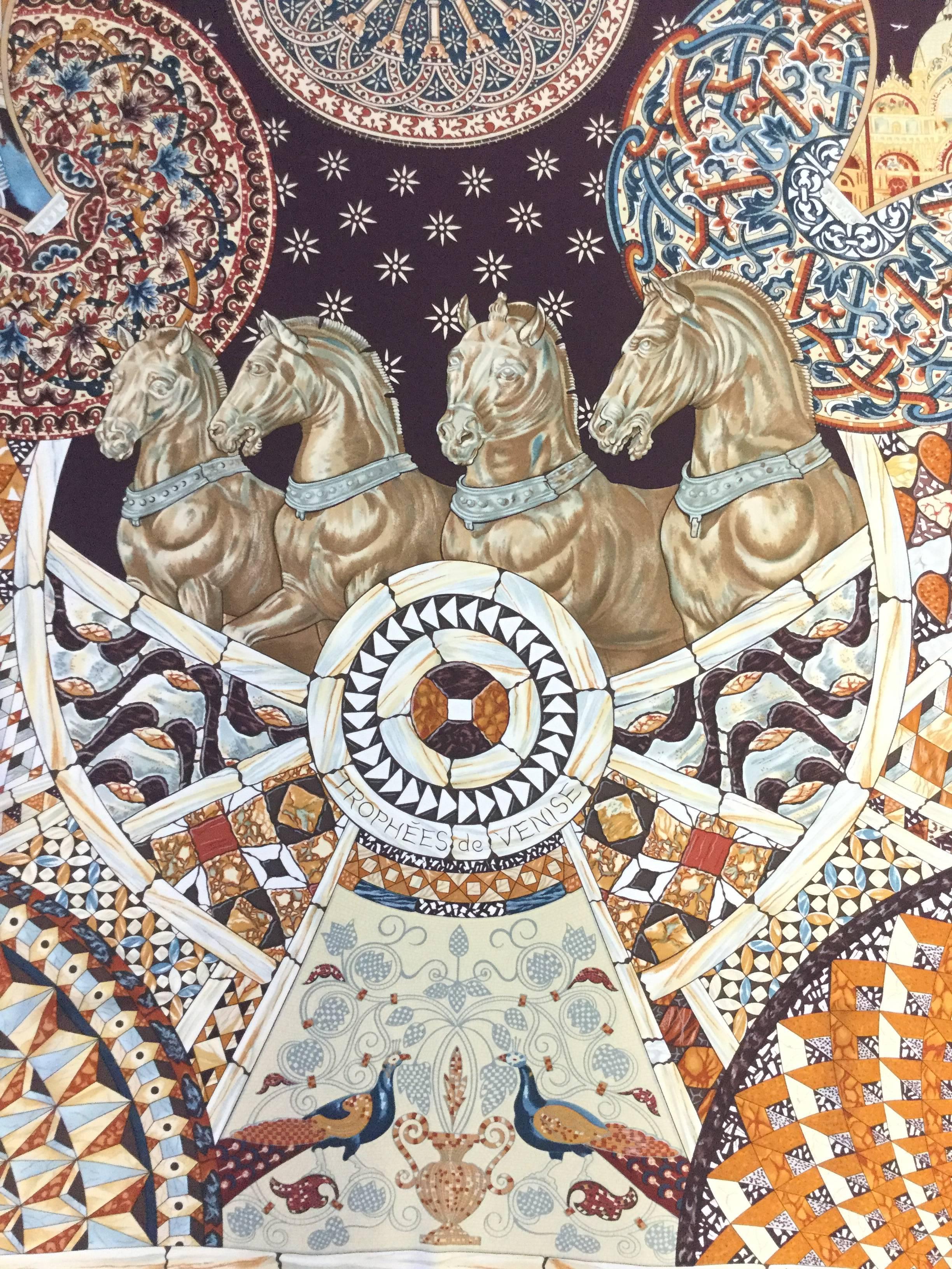 Gorgeous silk scarf by artist Julia Abadie for the 2001 Hermes Fall/Winter collection. The scarf is titled "Trophees De Venise" or "Trophies of Venice" and showcases some of Venice's finest cultural landmarks. At the very center