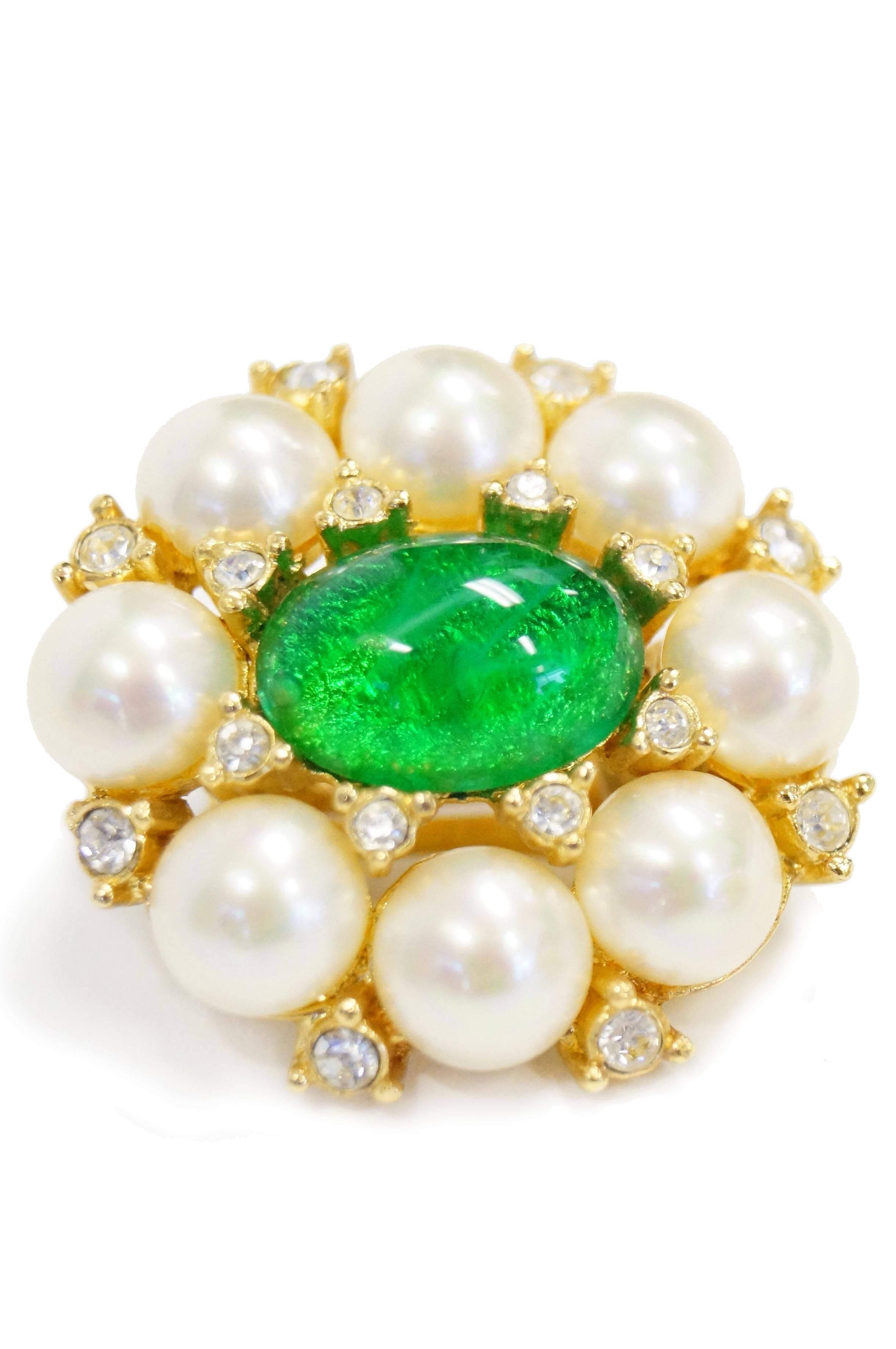 Magnificent Dior green poured glass and faux pearl and rhinestone clip on earrings (Germany). Faux pearls are set into a gold tone foundation with a large green poured glass center all surrounded with clear rhinestones.

1.5 X 1.25 inches
10 Grams