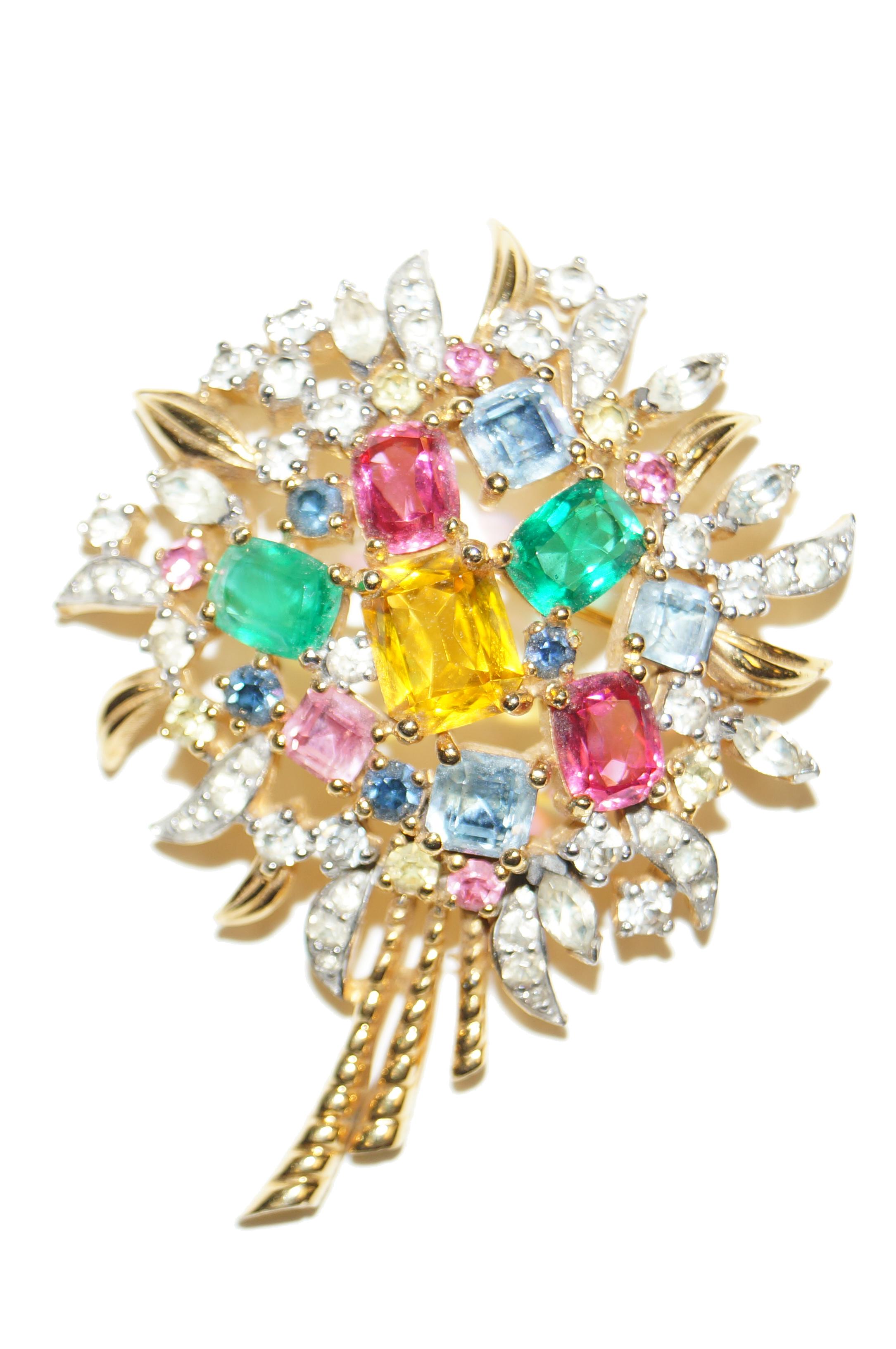 Multi colored crystal rhinestones brighten this gold and silver bouquet by Jomaz from the 1950s. Demi Parure includes coordinating clip on earrings. Perfect Mother of the Bride gift for an upcoming spring or summer wedding. 

Earrings 1.5 x 1.5