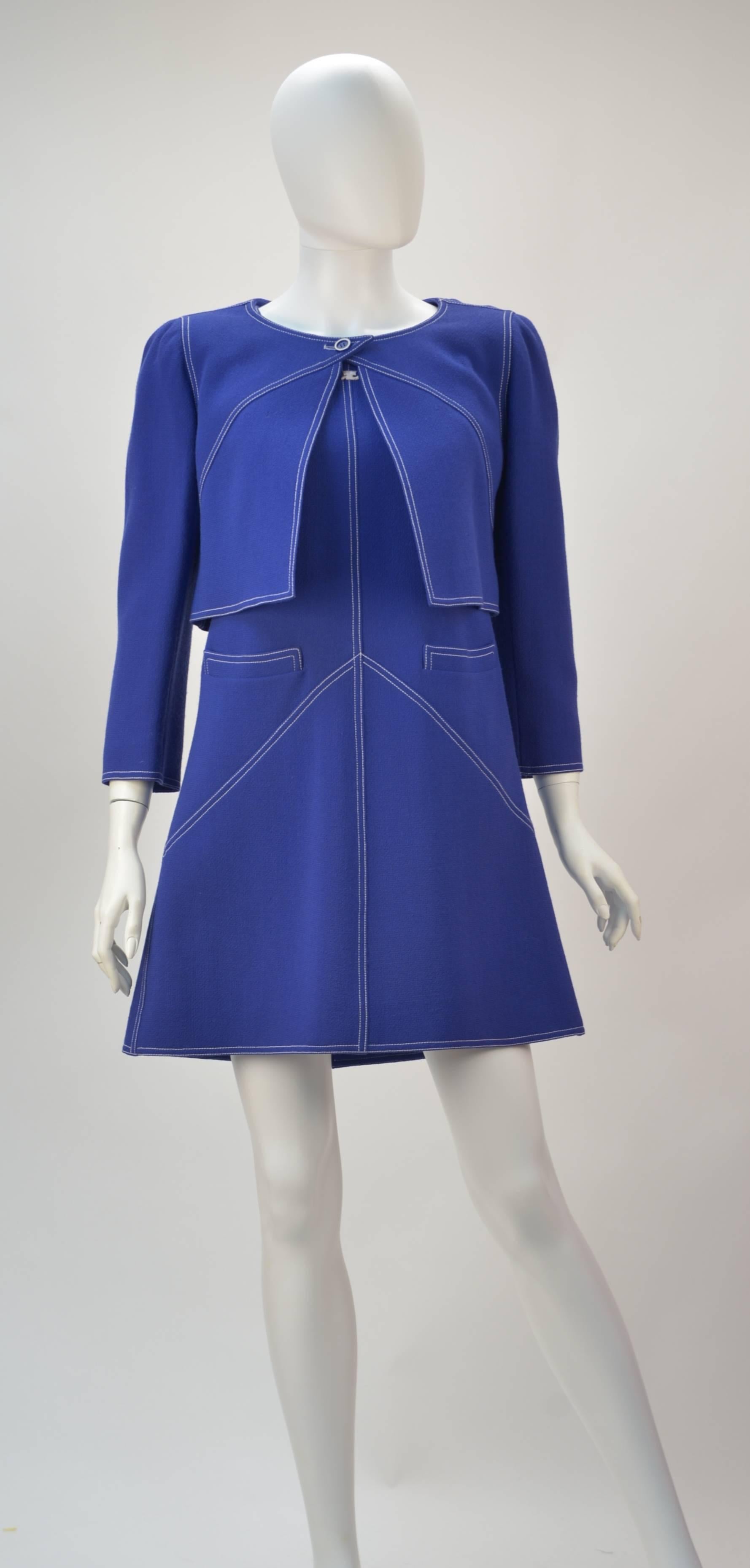 Very mod yet so now comes this Courreges wool ensemble (See Jacket Pictured Below). The color is absolutely beautiful... it is blue and it is purple.*  

The sleeveless dress has the Courreges signature logo at center front neck and strategically